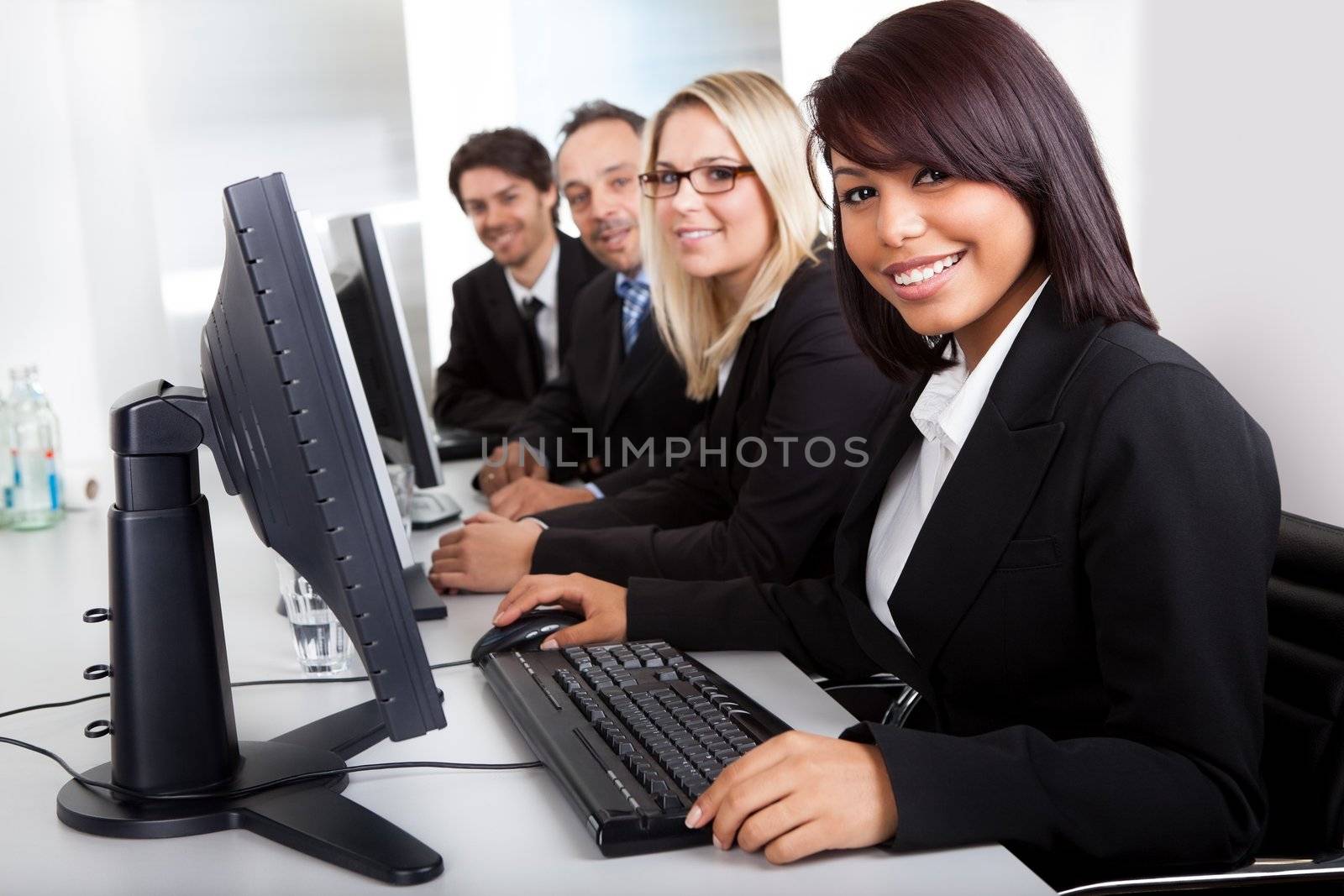 Group of business people in the office working on computers