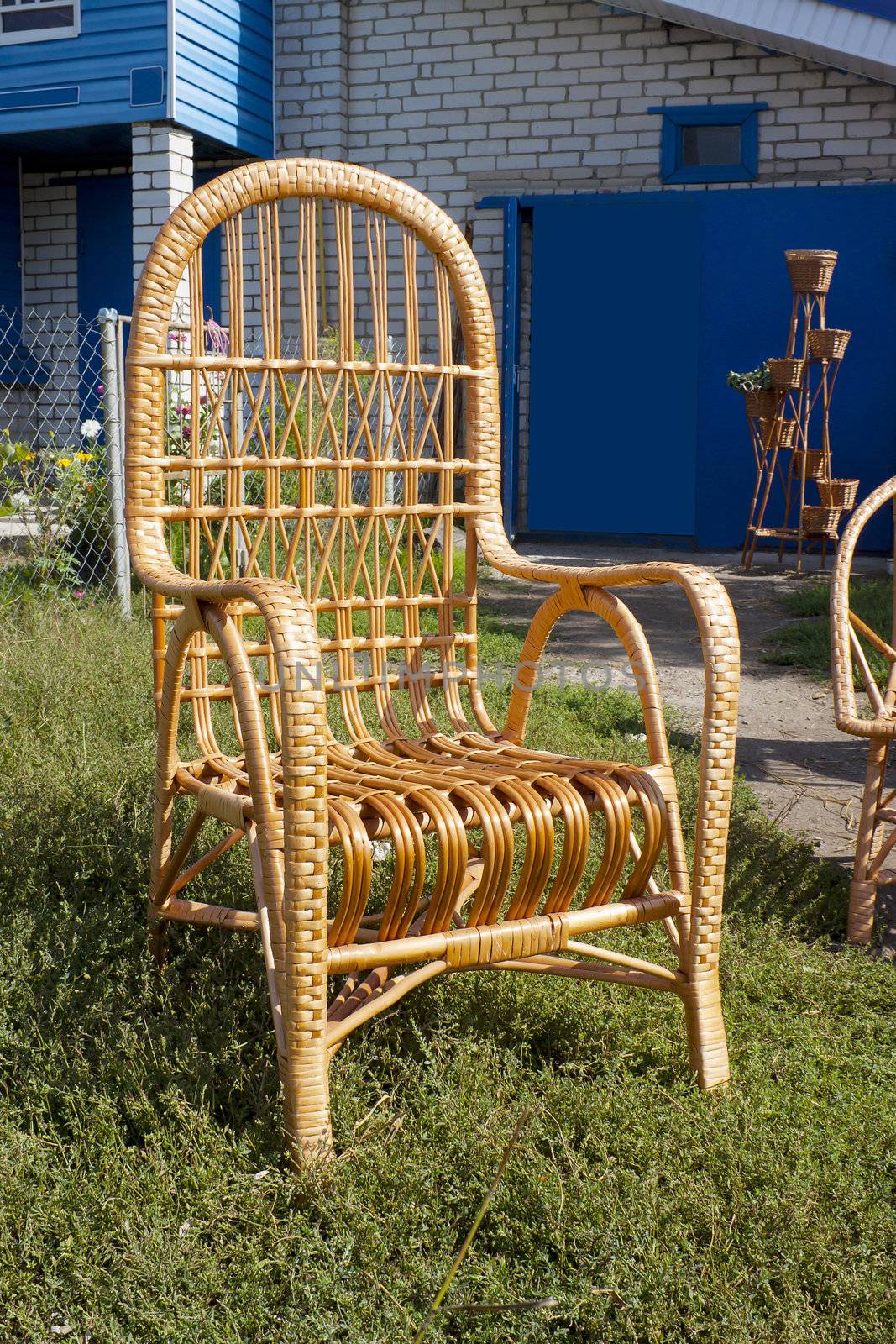 Armchair from willow rods at the rural house