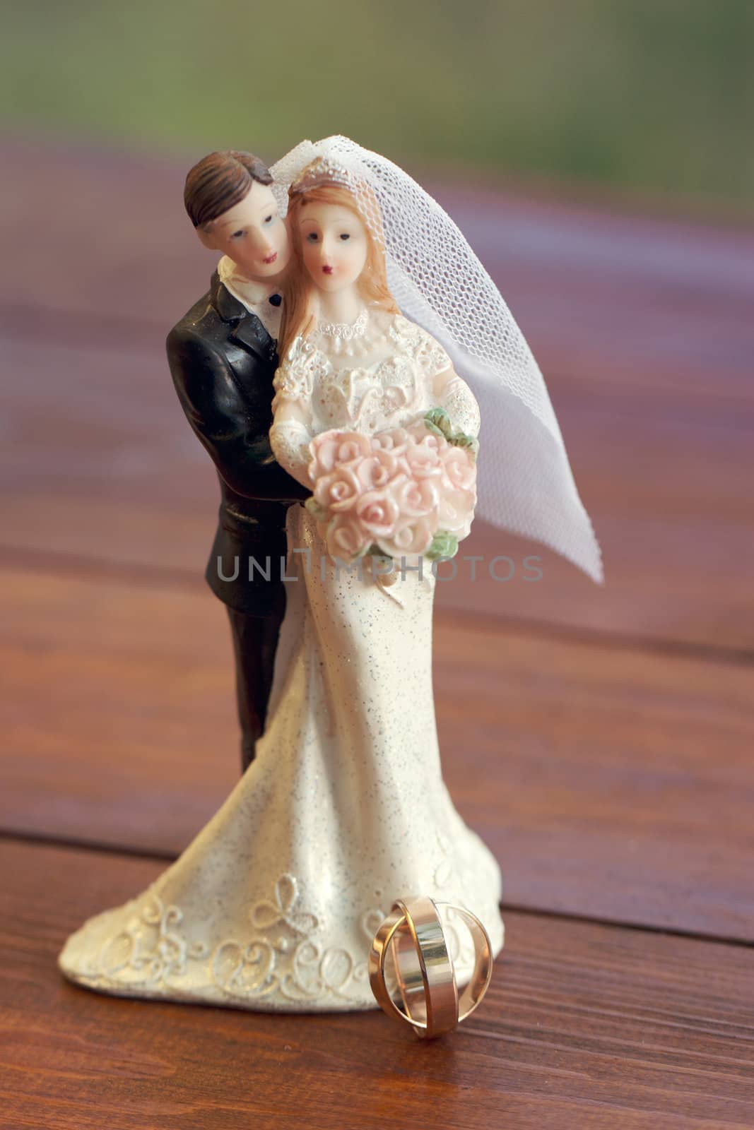 Bride and groom figurines on the boards