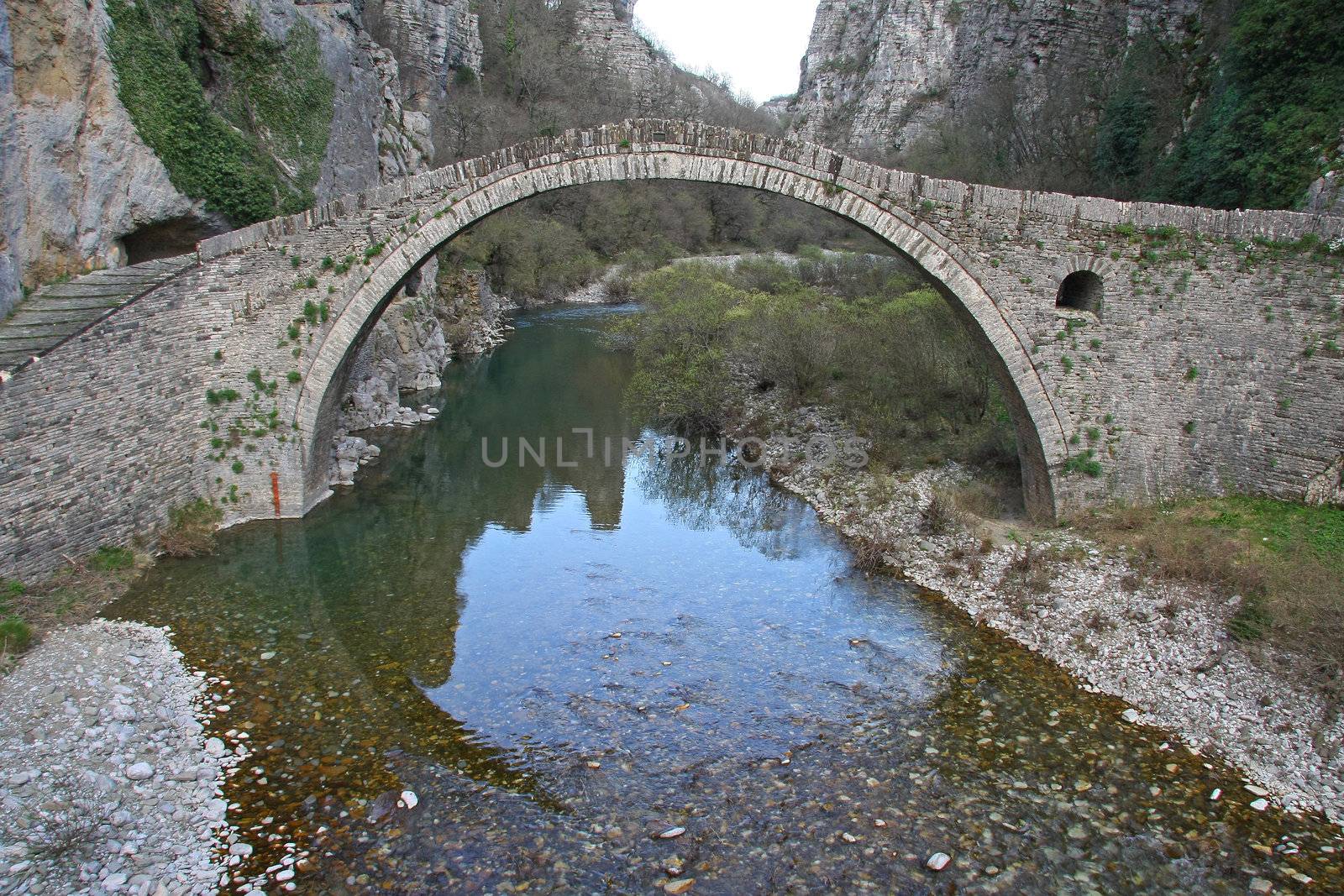 Old stone bridge by smixiotis_dimitrios