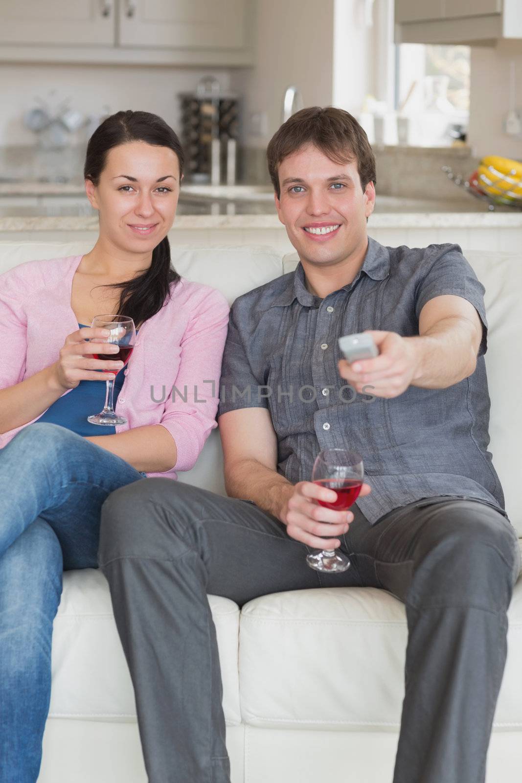 Couple relaxing on the couch by Wavebreakmedia