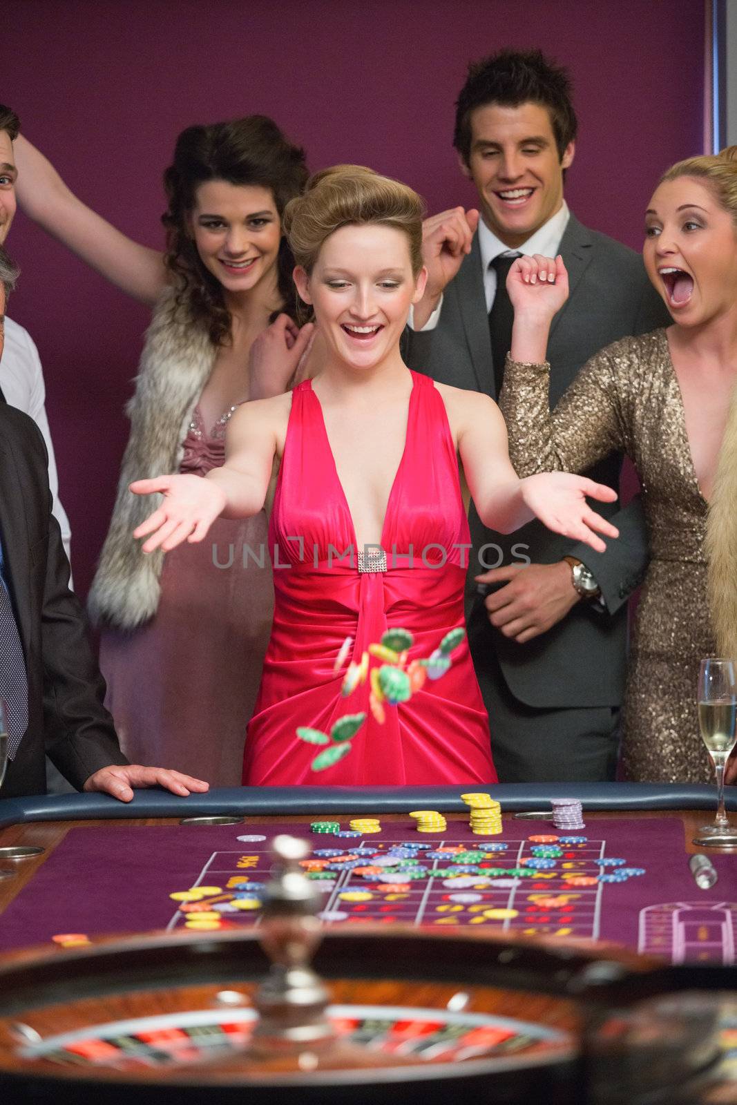 Woman winning at roulette by Wavebreakmedia