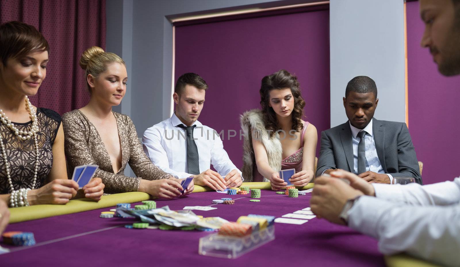 People at the poker table in casino