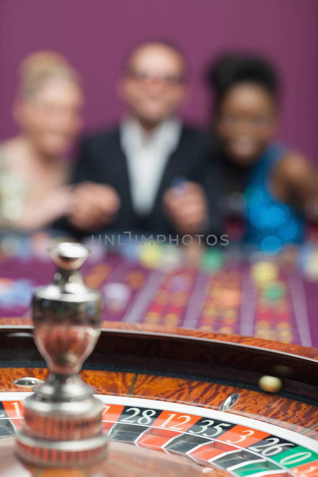 People playing roulette by Wavebreakmedia