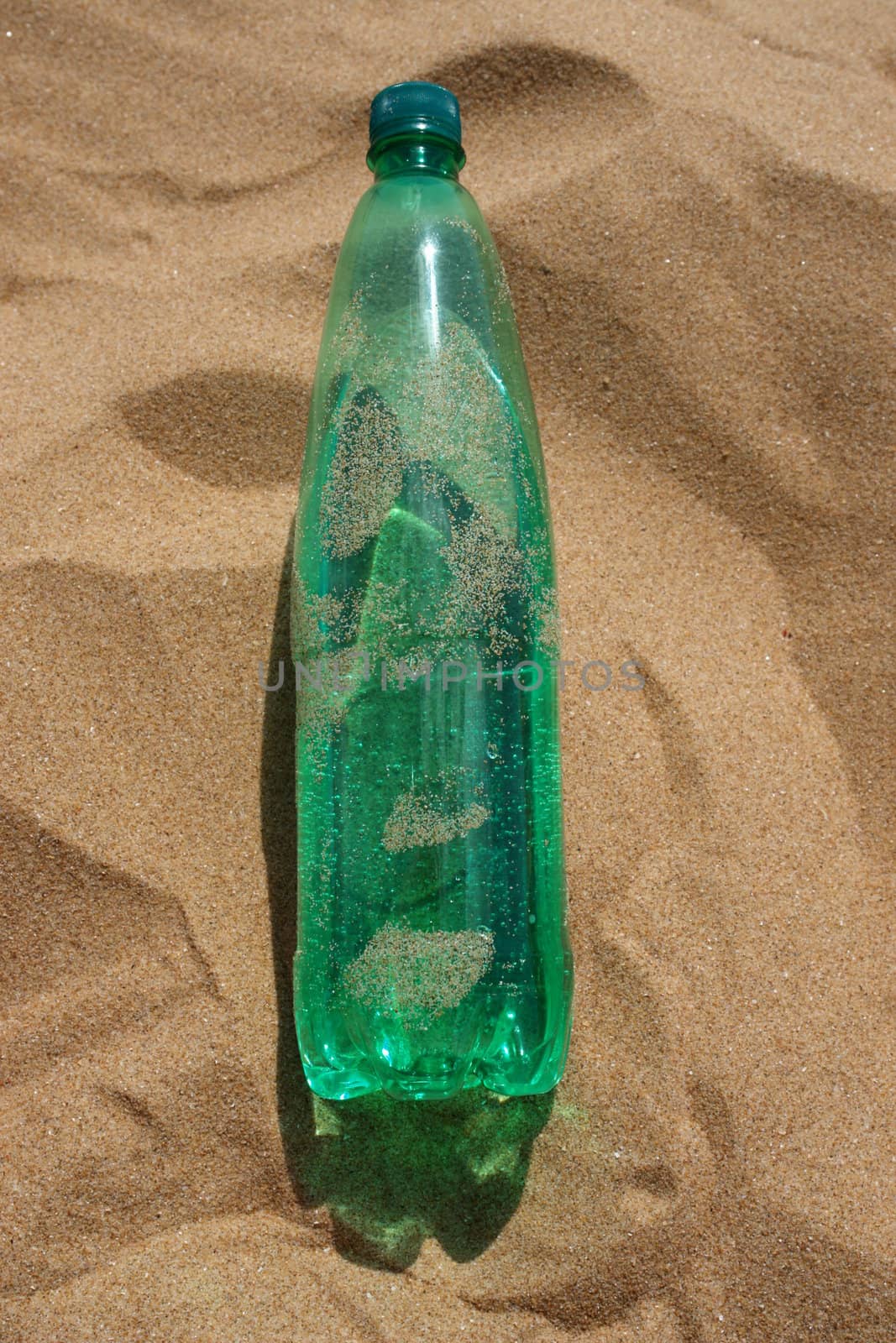 water bottle at the beach on a hot day