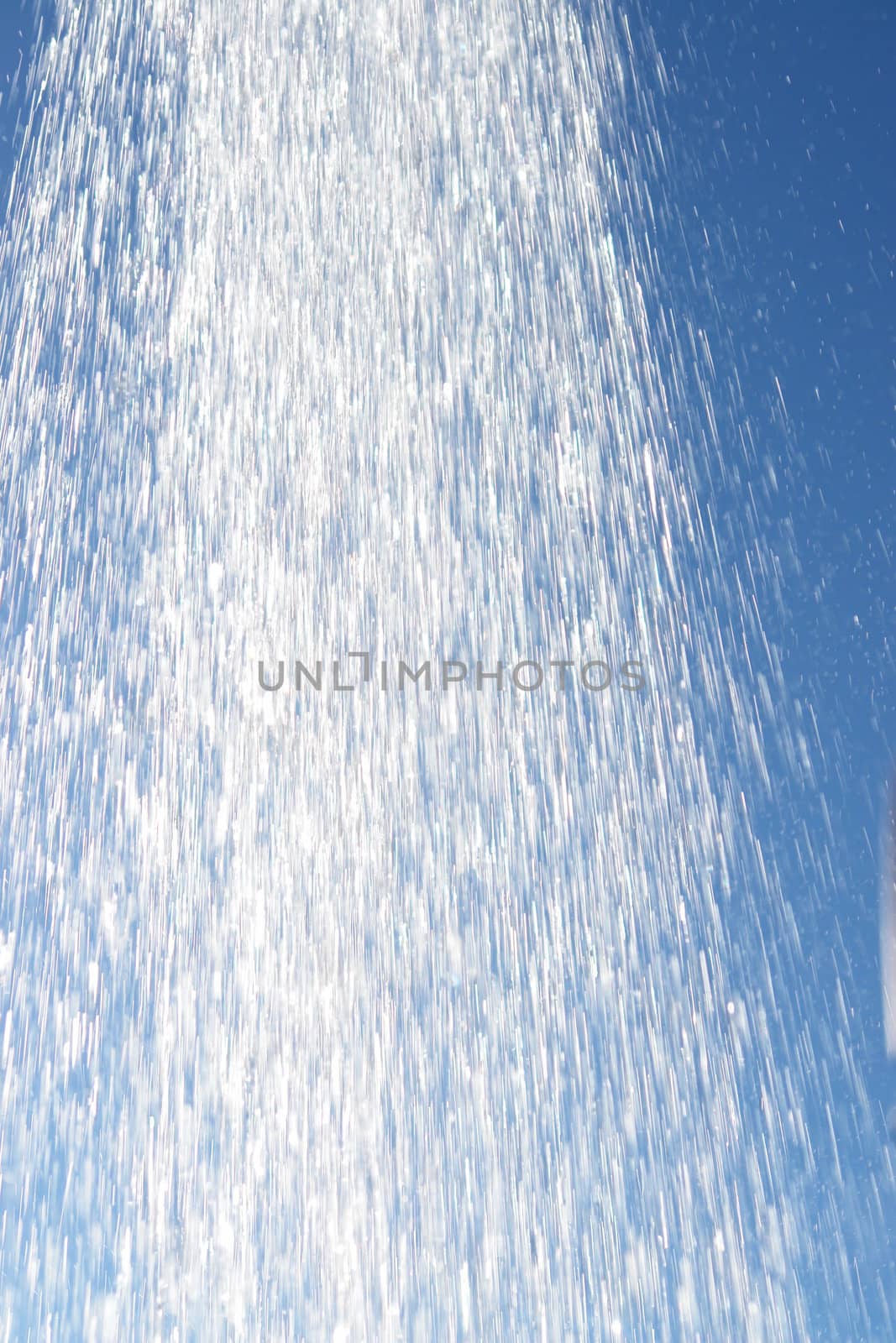 water drops falling from a shower outside