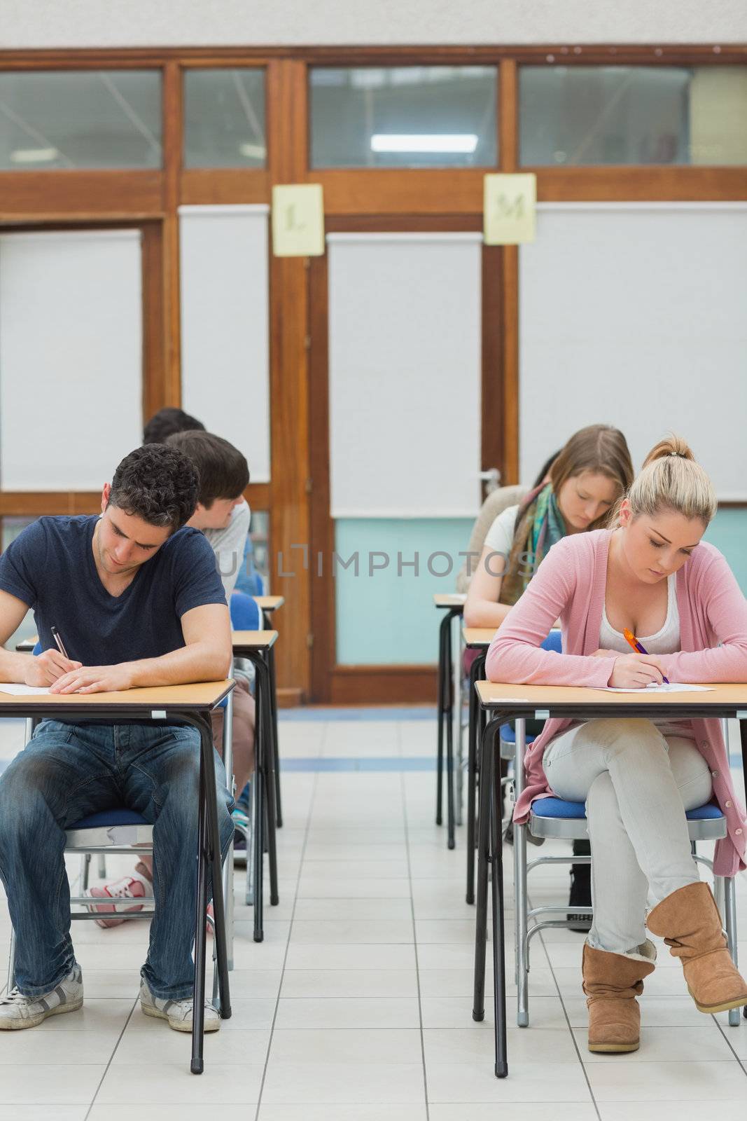 Students sitting an exam in college