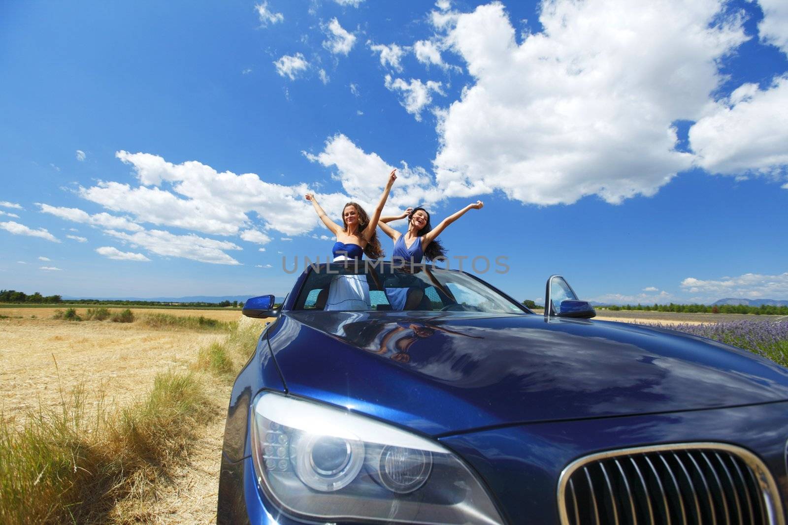 women dance in car