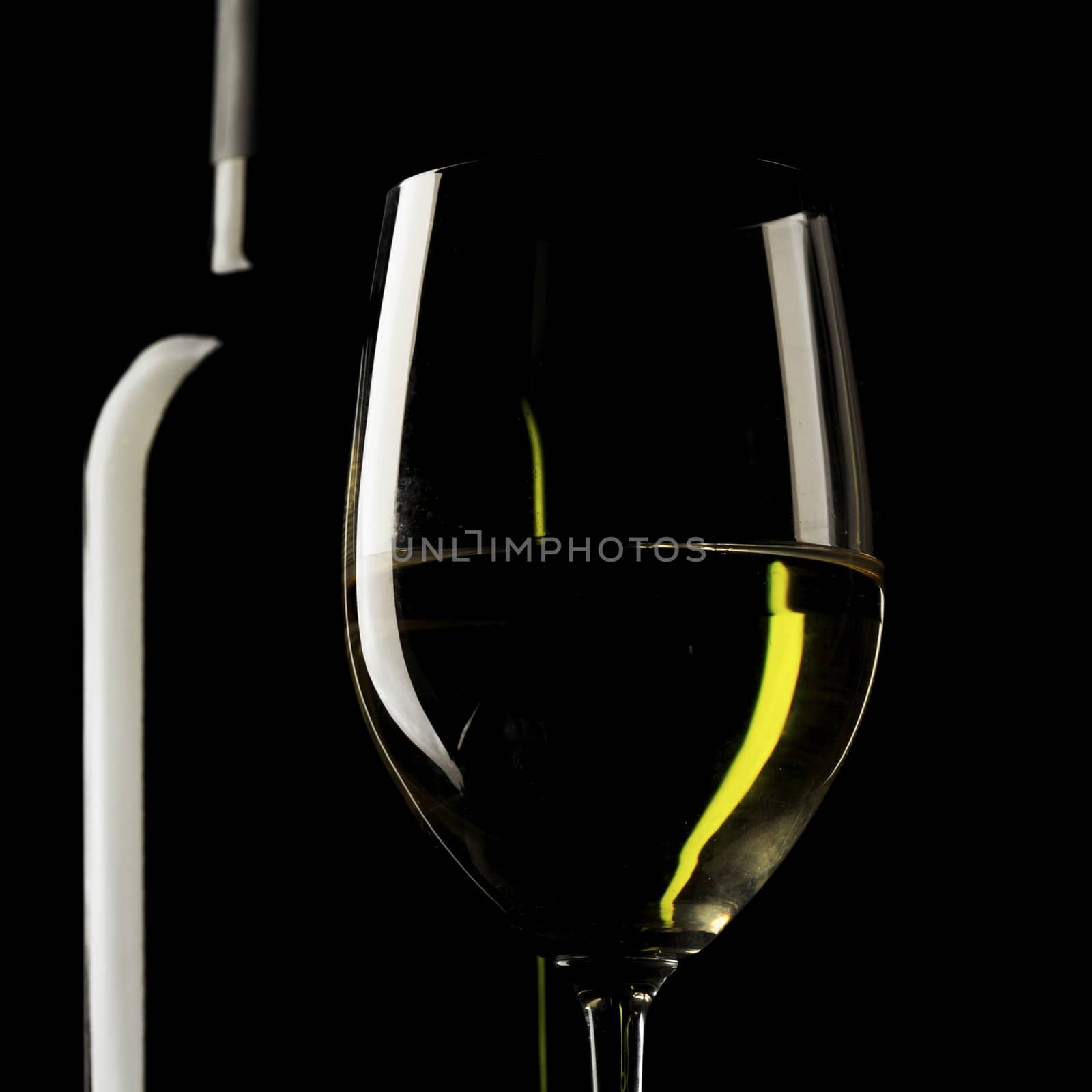 white wine glass silhouette black background