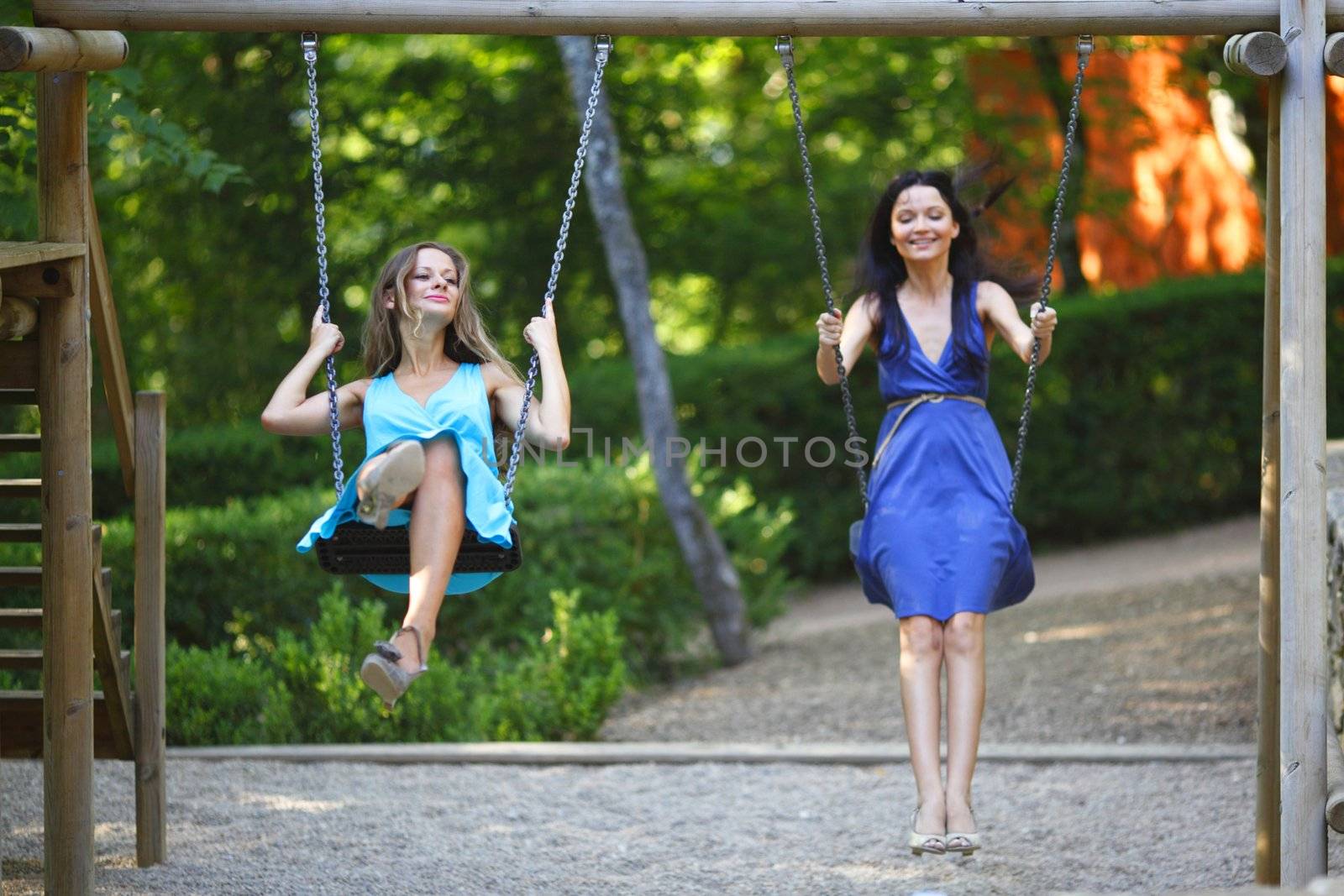 young women swinging