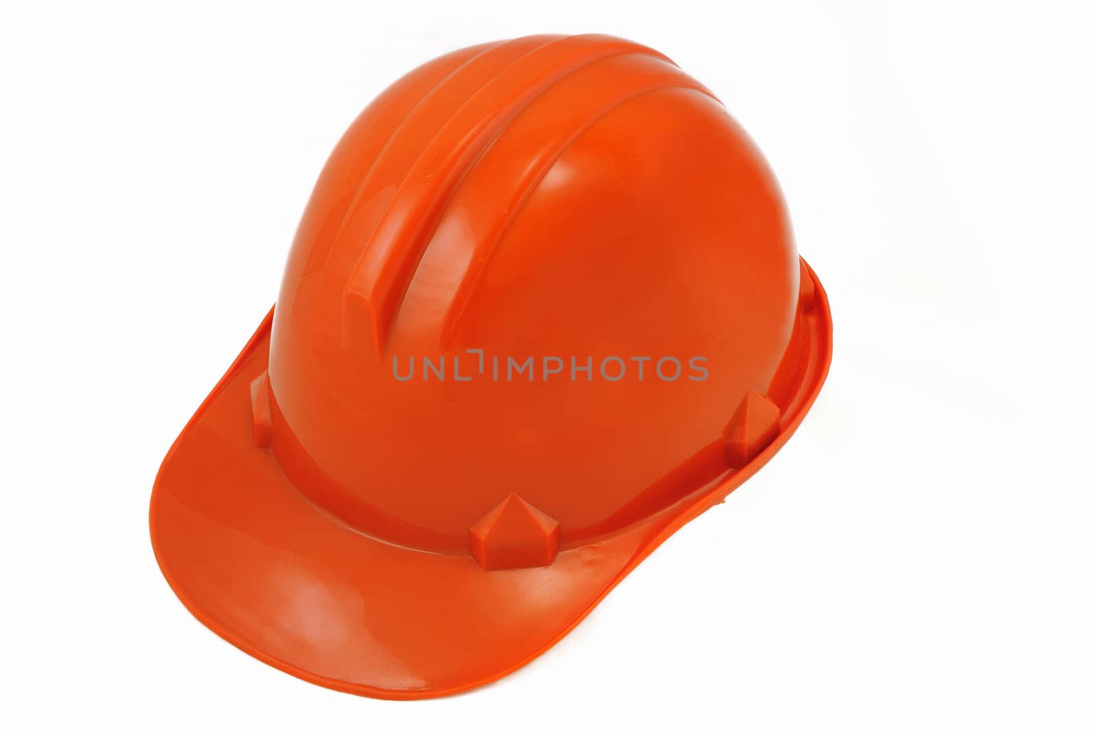 Plastic orange safety helmet isolated on white background.