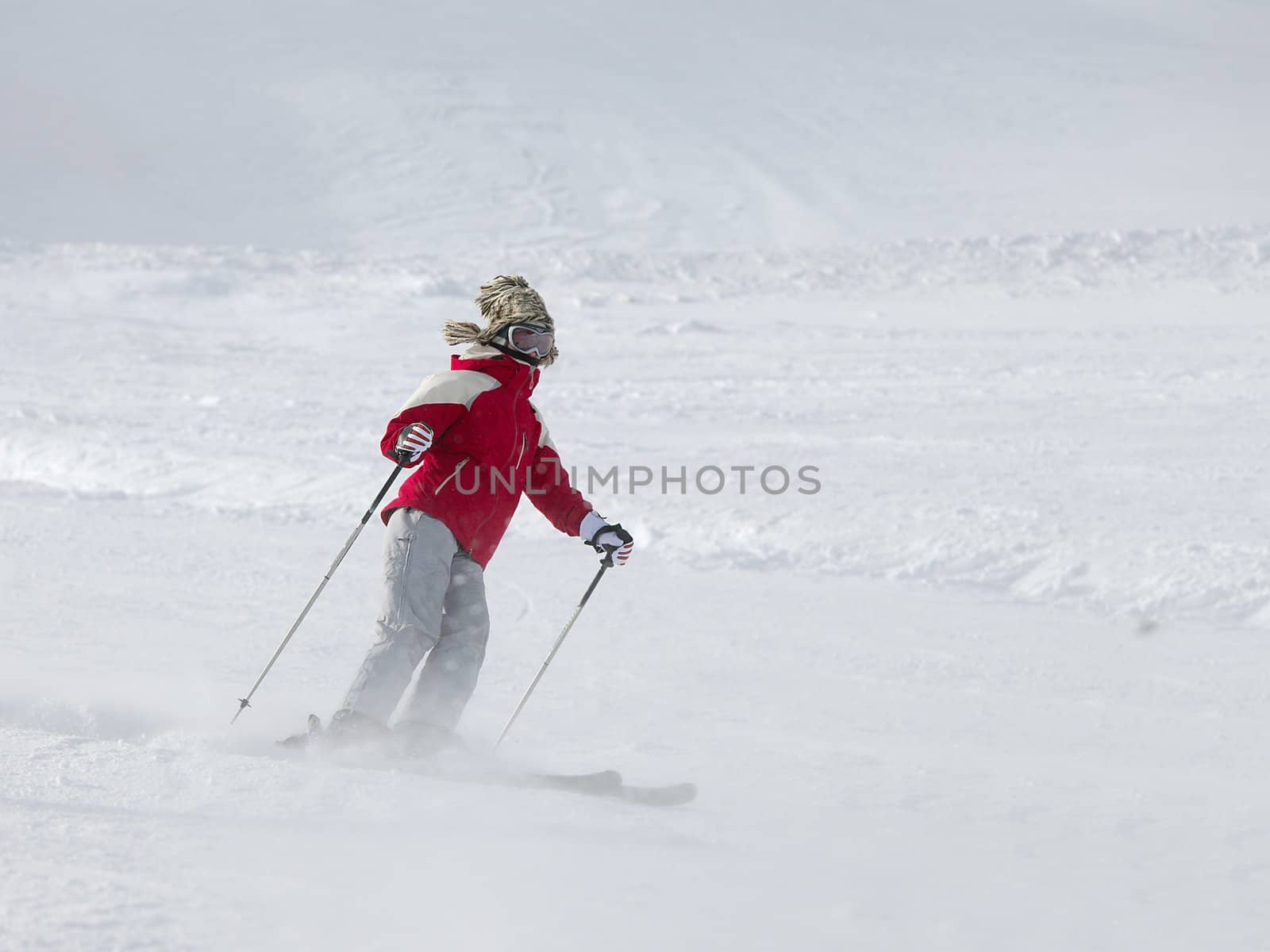 Skier coming down the slope fast