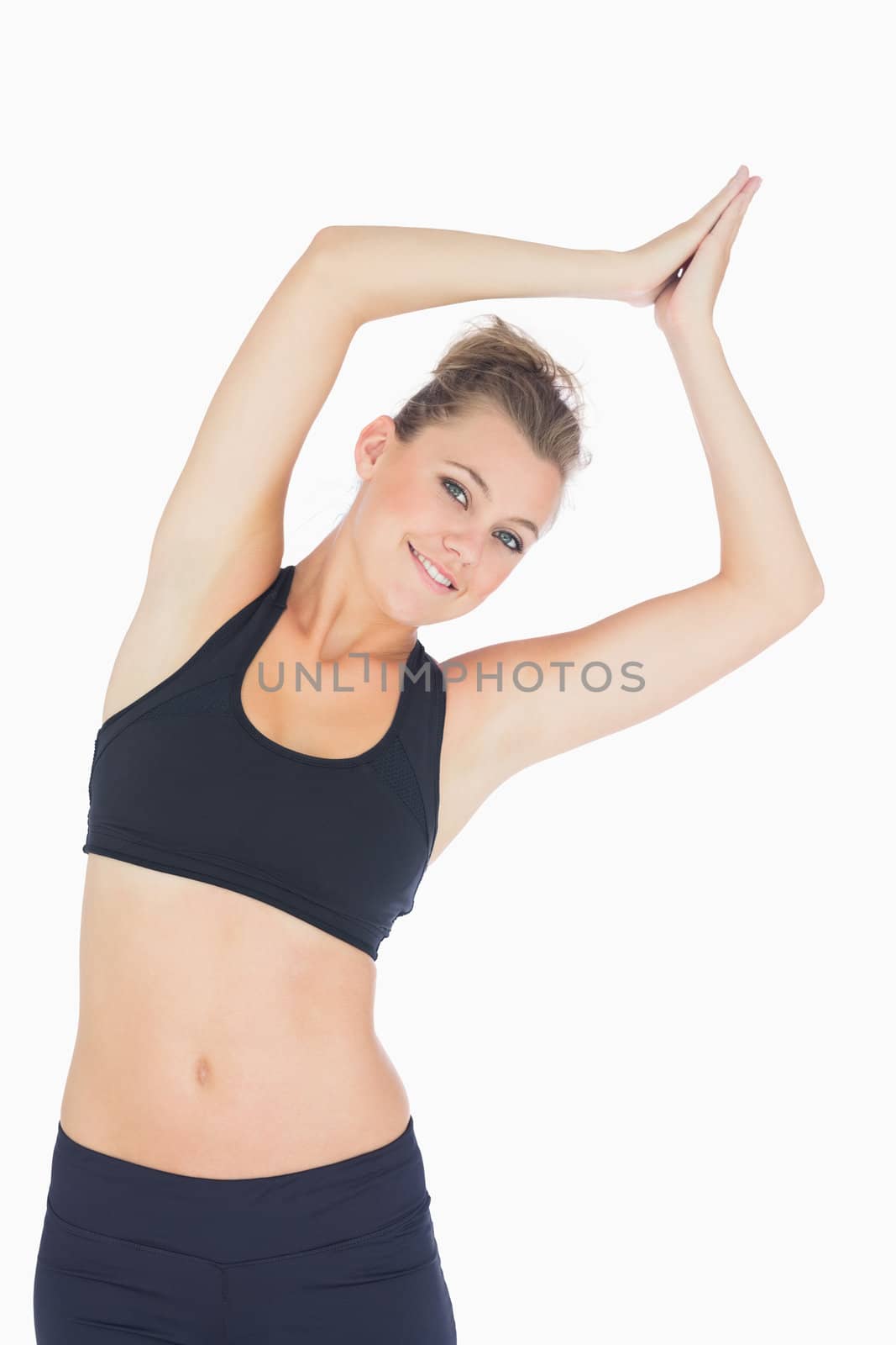 Woman stretching in yoga pose wearing sportswear