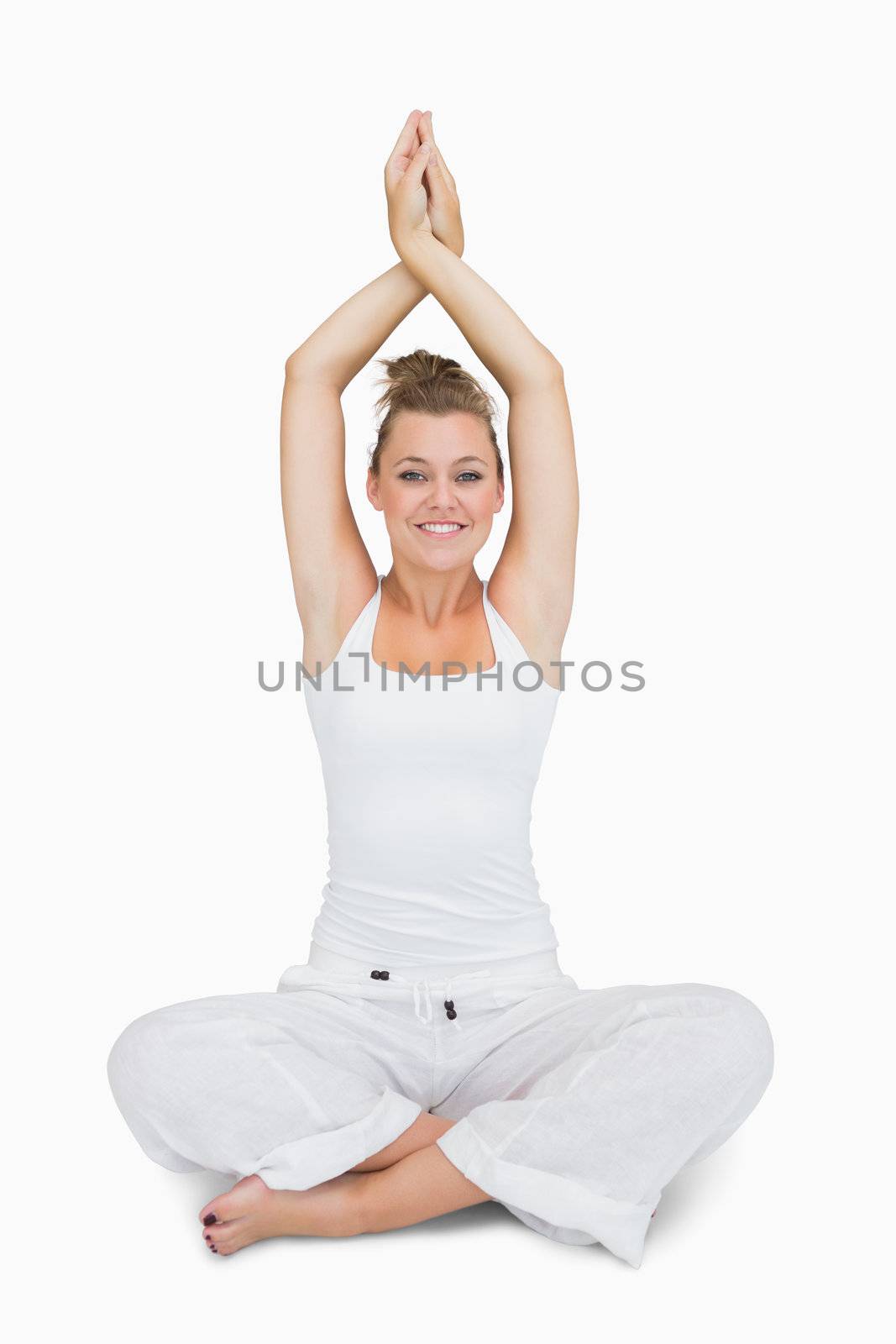 Smiling girl sitting in lotus yoga pose