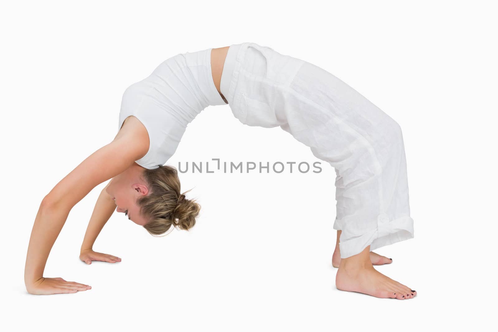 Girl in upward bow yoga pose by Wavebreakmedia