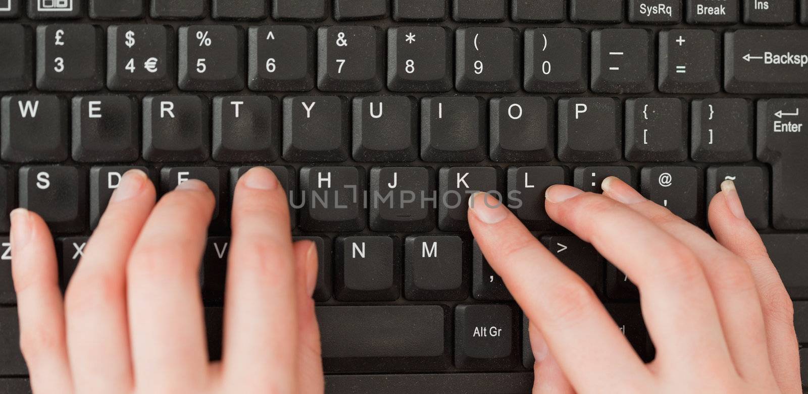 Woman hands typing on a screen