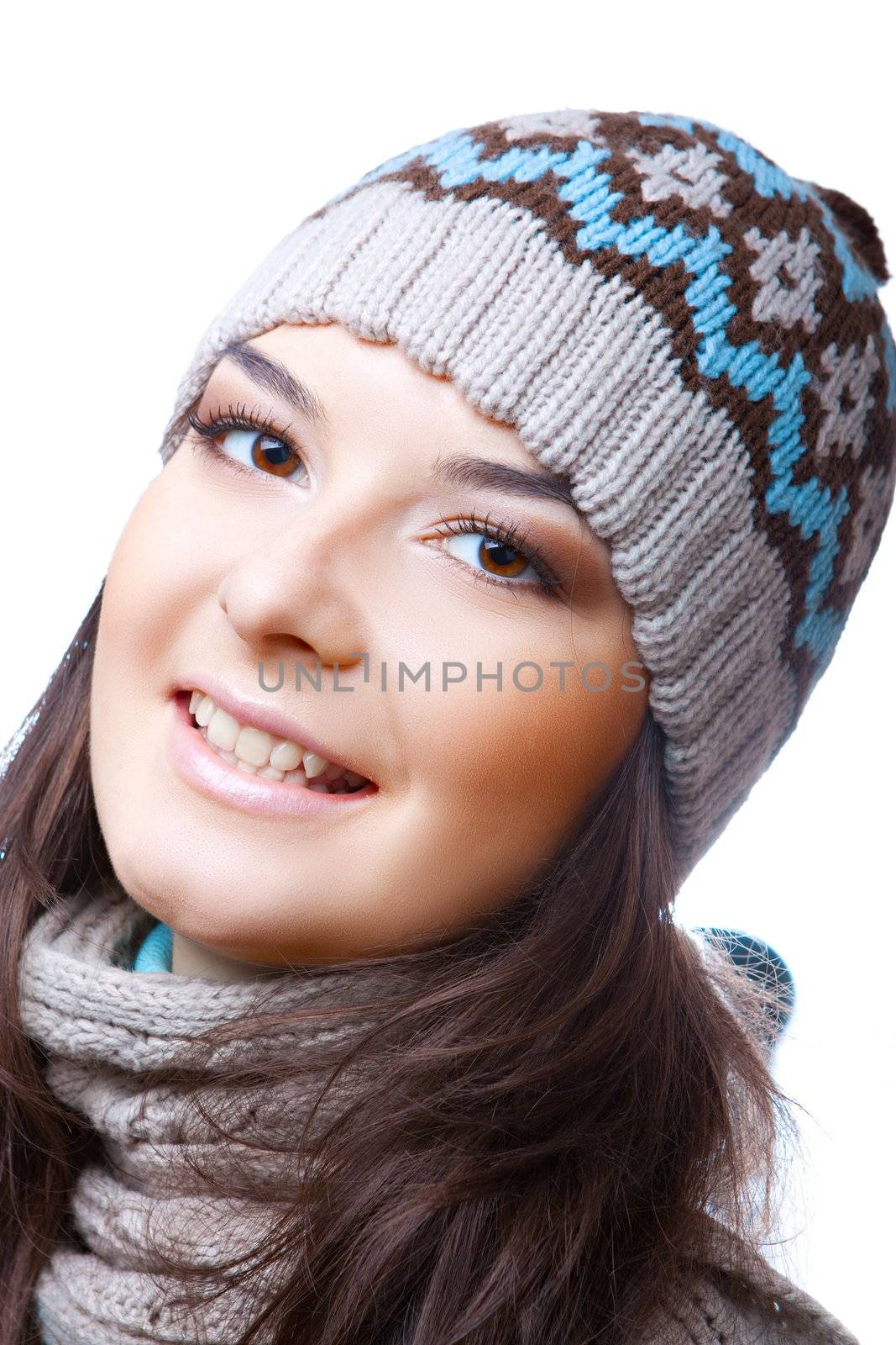 Smiling woman in a cap on the white isolated background