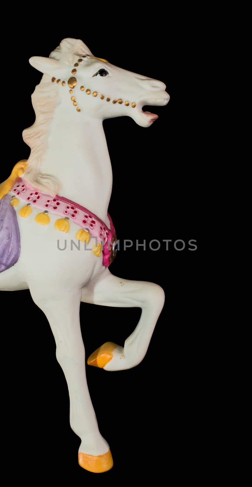 Colorful carousel horse isolated on black background