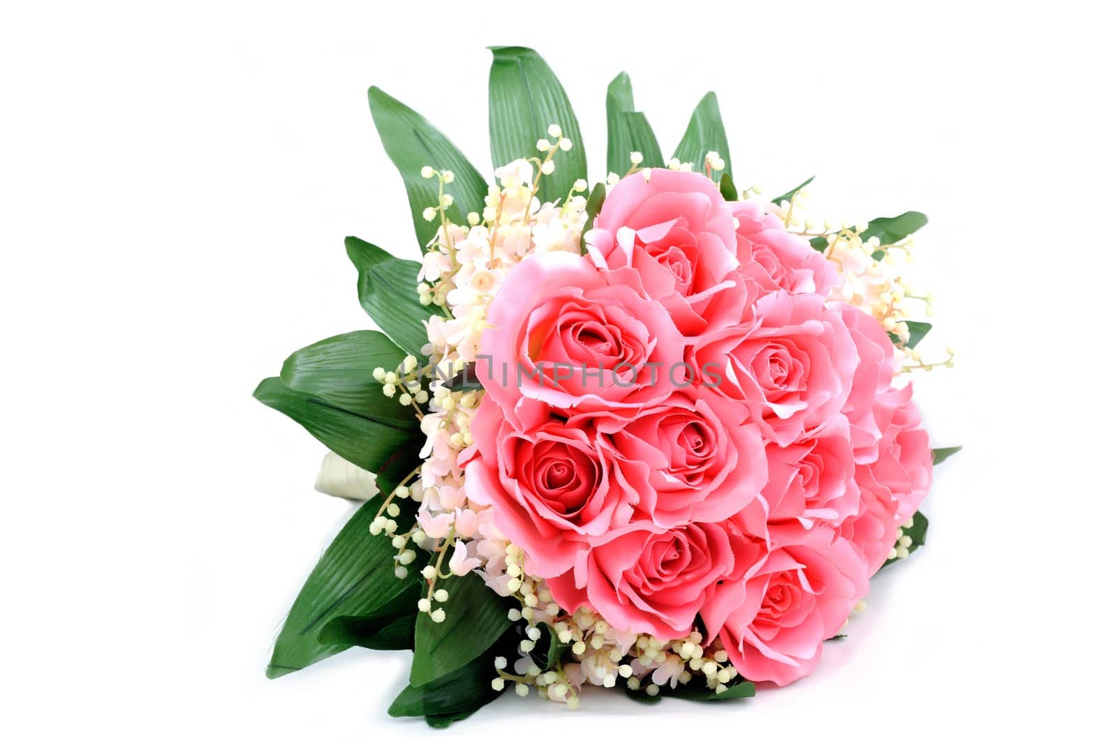 Bouquet of pink fabric roses isolated on white background.