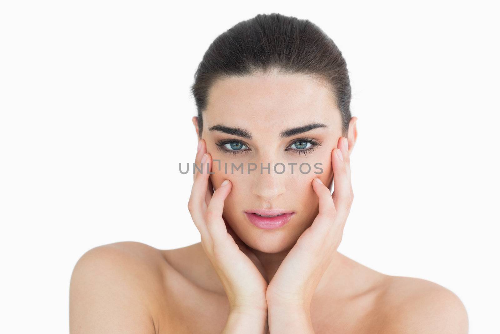 Woman touching her cheek by Wavebreakmedia