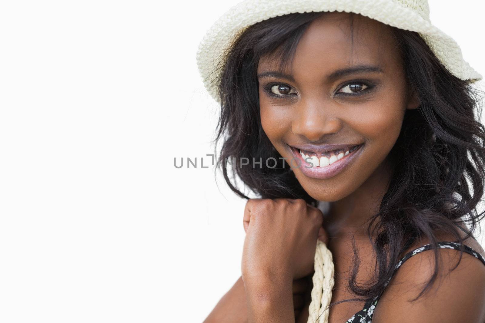 Smiling woman in summer fashion on white background