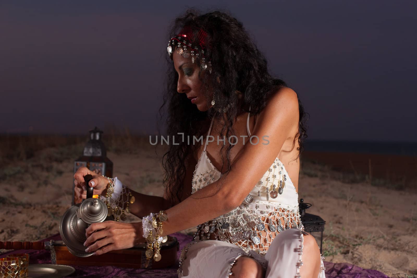 Beautiful brunette serving tea in an African setting