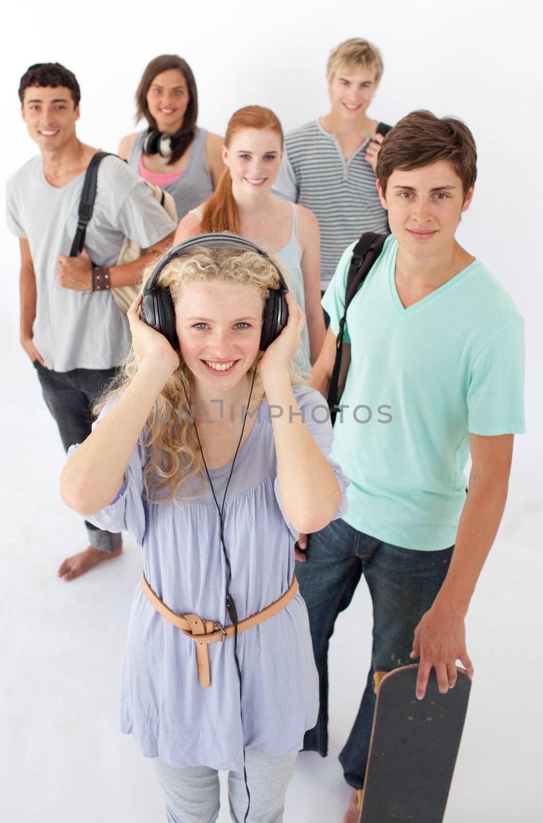 Happy teenagers smiling at the camera by Wavebreakmedia