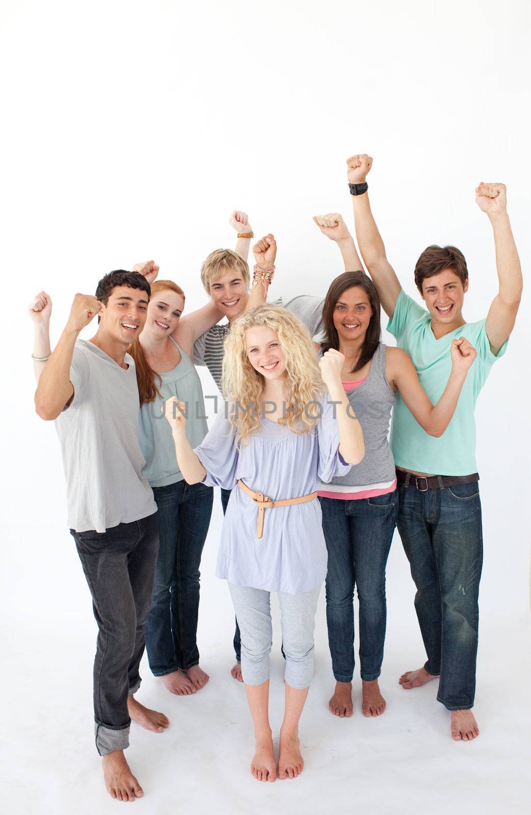 Successful friends standing against white background