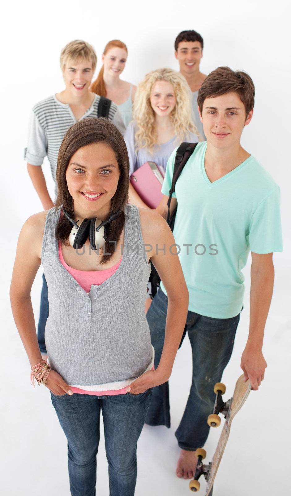 Happy teenagers smiling at the camera by Wavebreakmedia