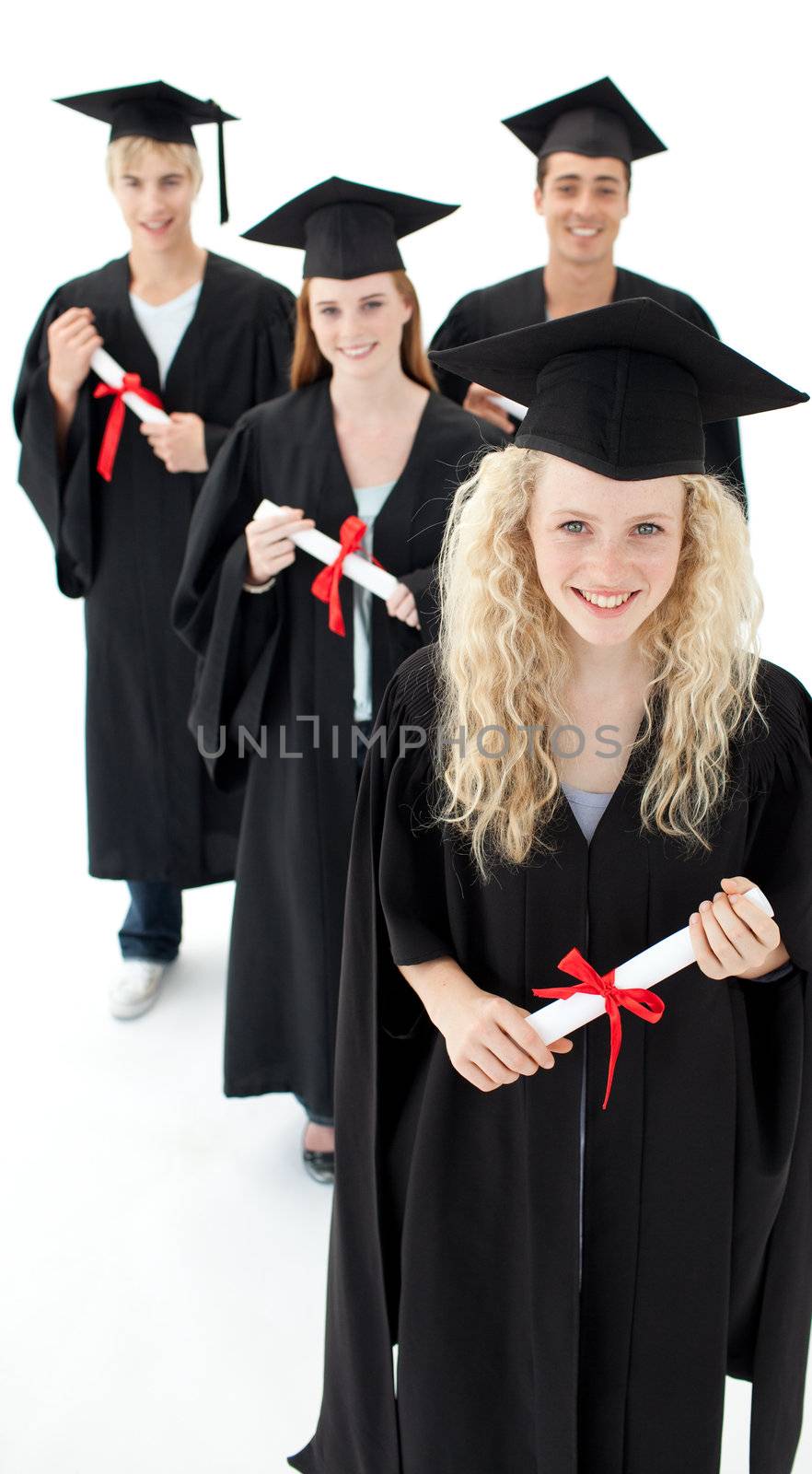 Smiling group of teenagers celebrating after Graduation