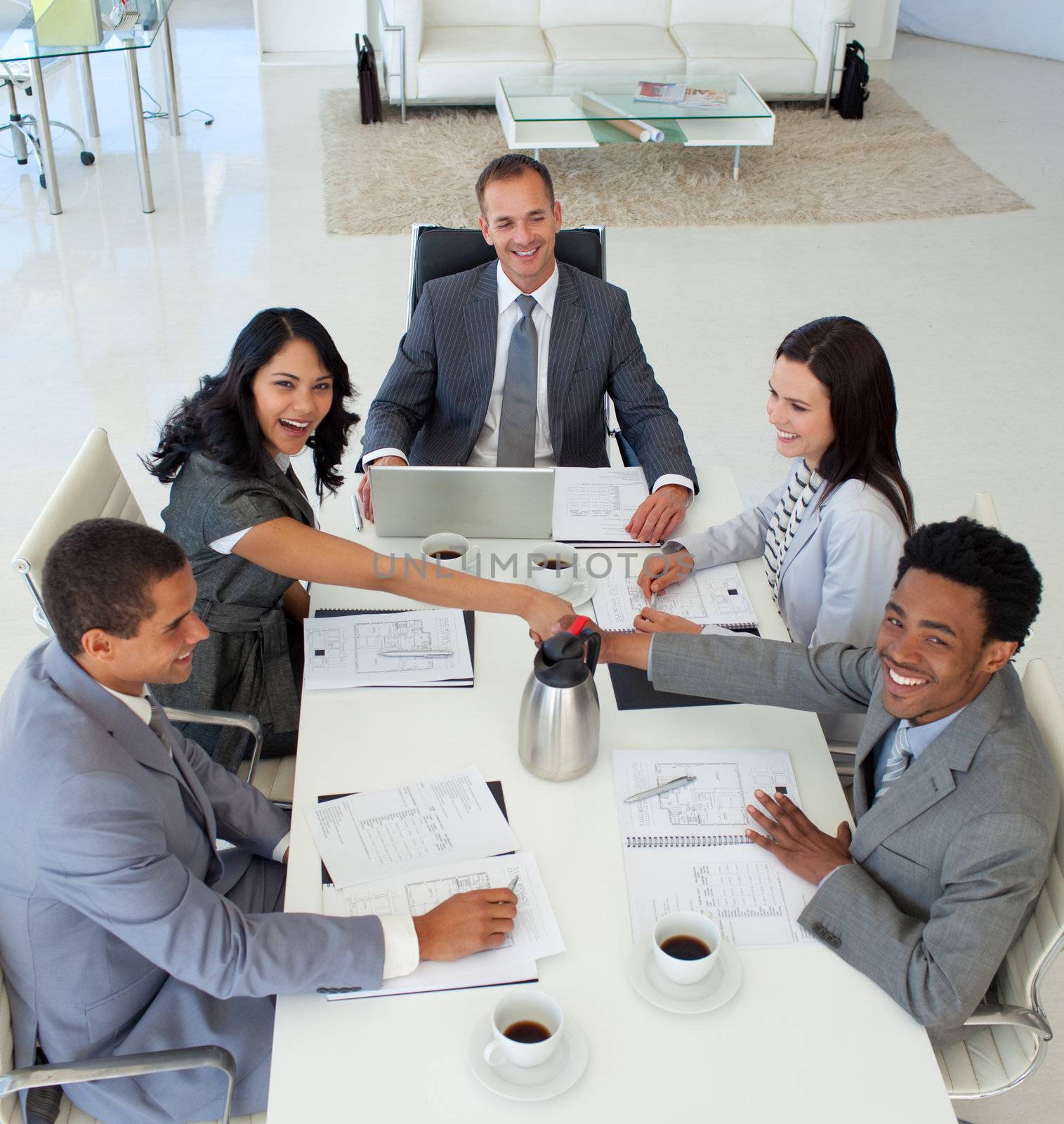 Business people shaking hands in a meeting by Wavebreakmedia