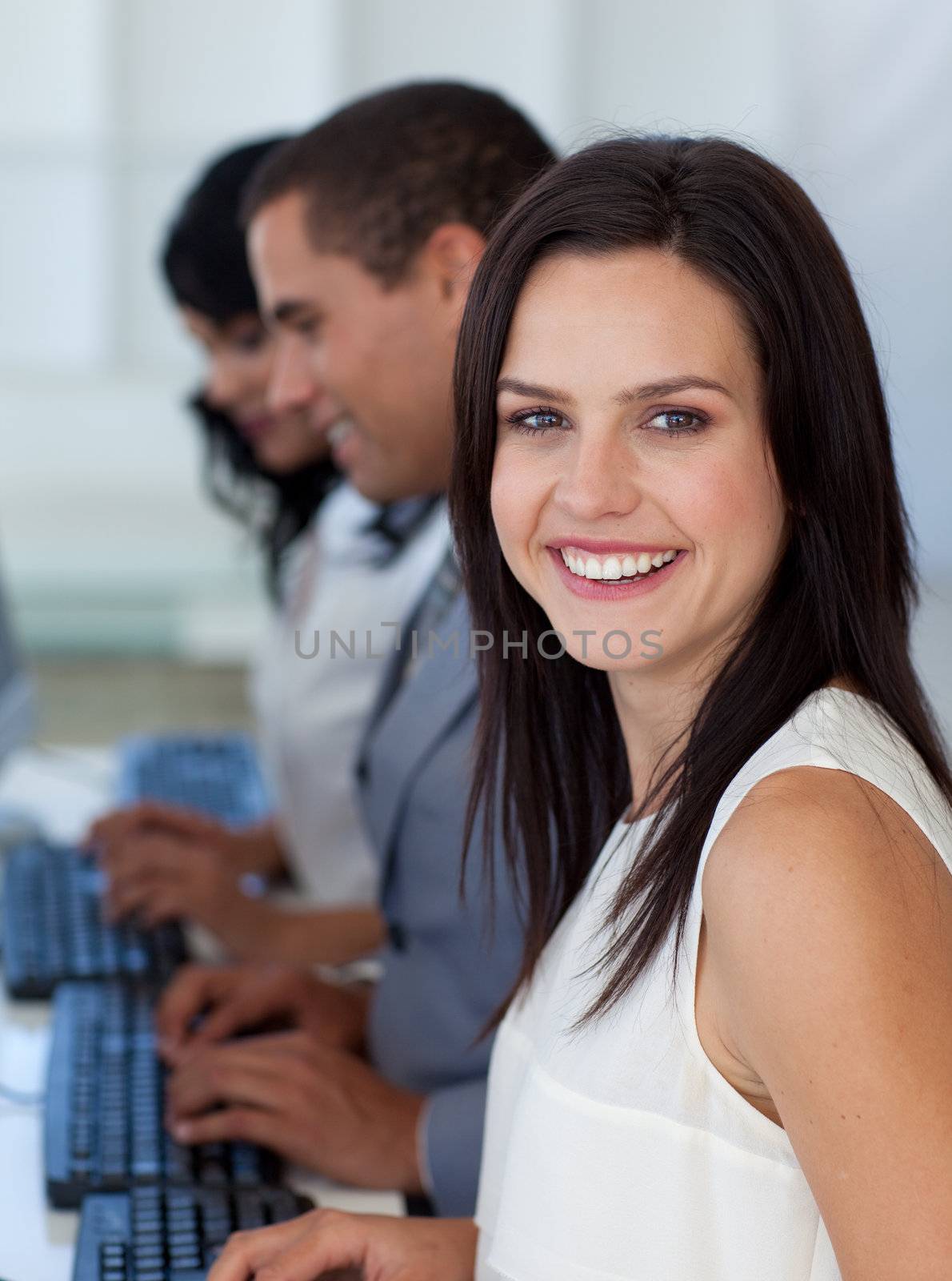 Beautiful businesswoman working in a company with a computer