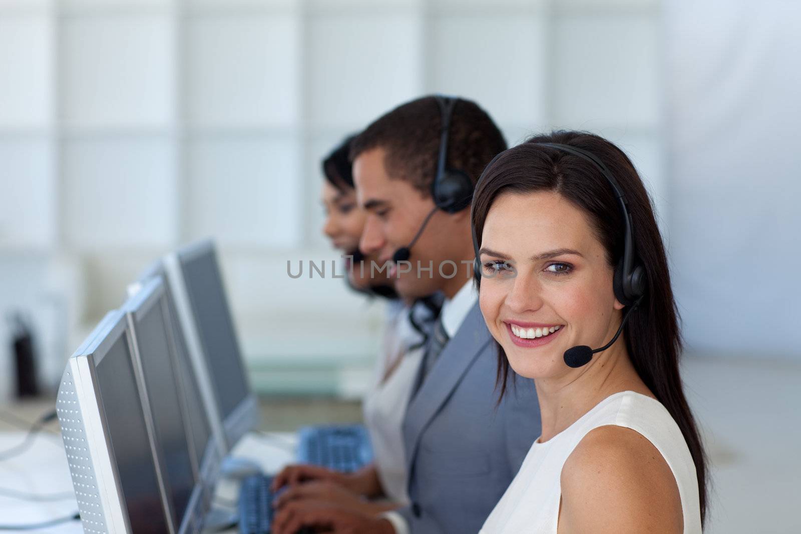 Smiling beautiful businesswoman working in a call canter 