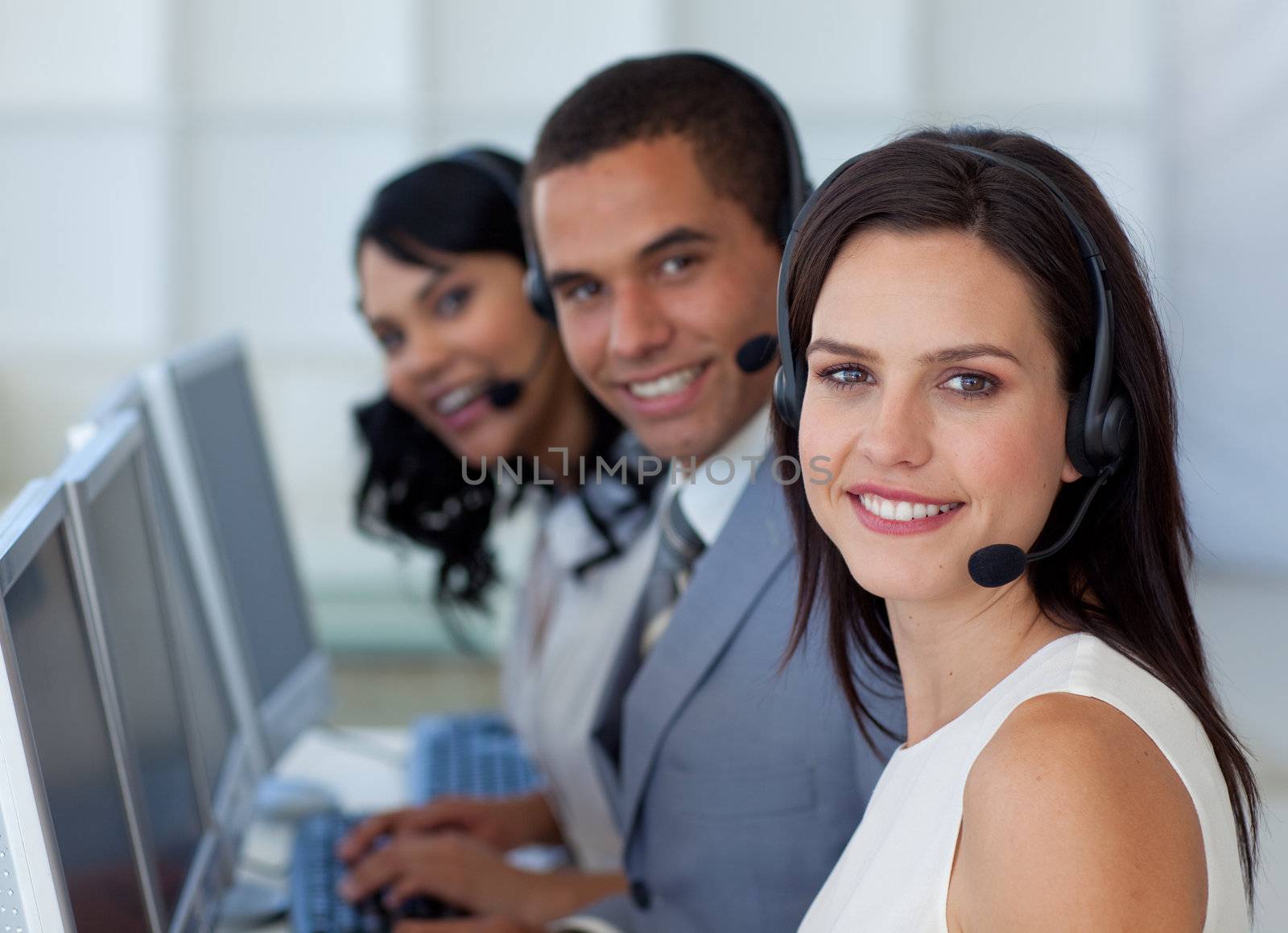 Smiling beautiful businesswoman working in a call canter 