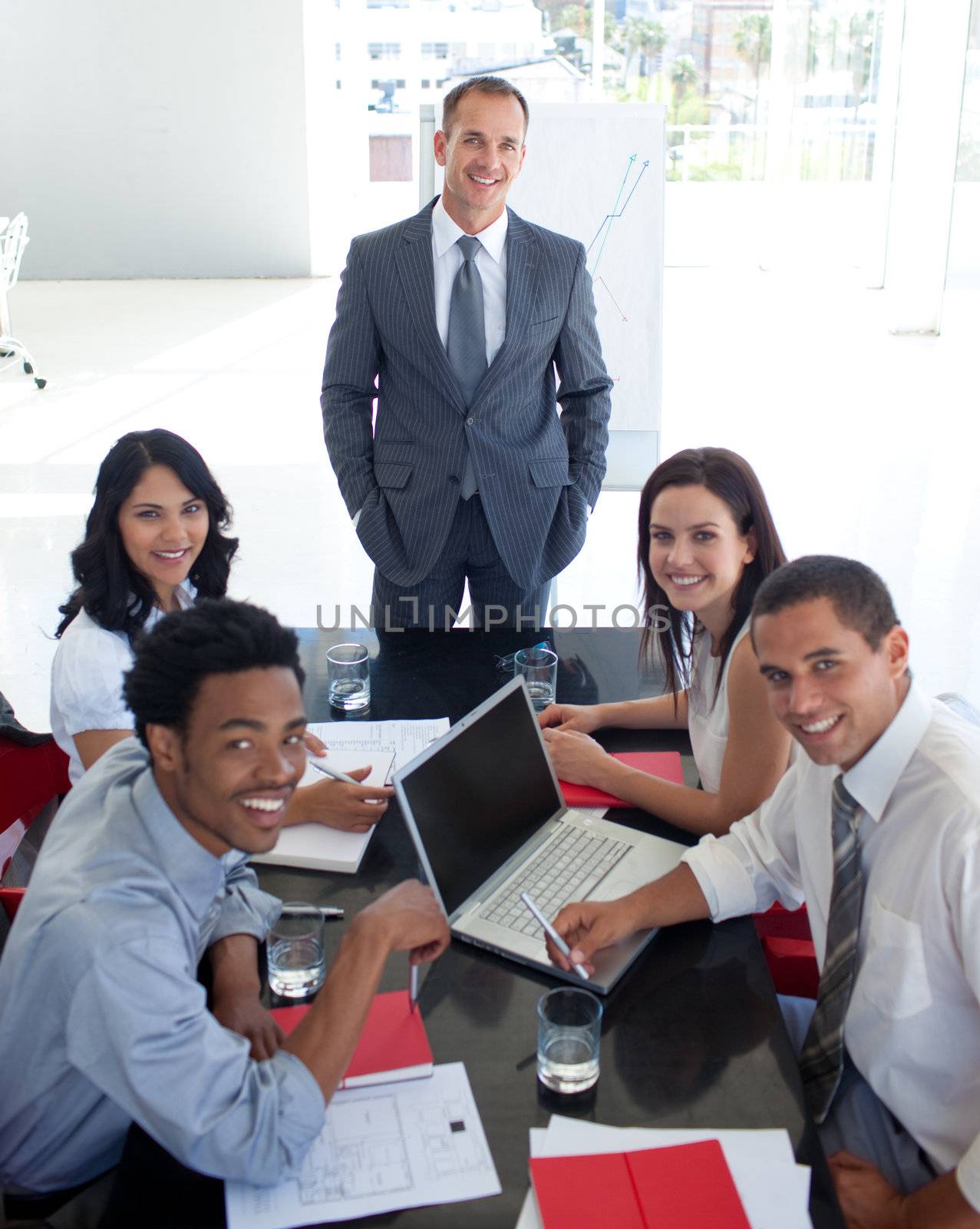 Business people smiling in a meeting by Wavebreakmedia