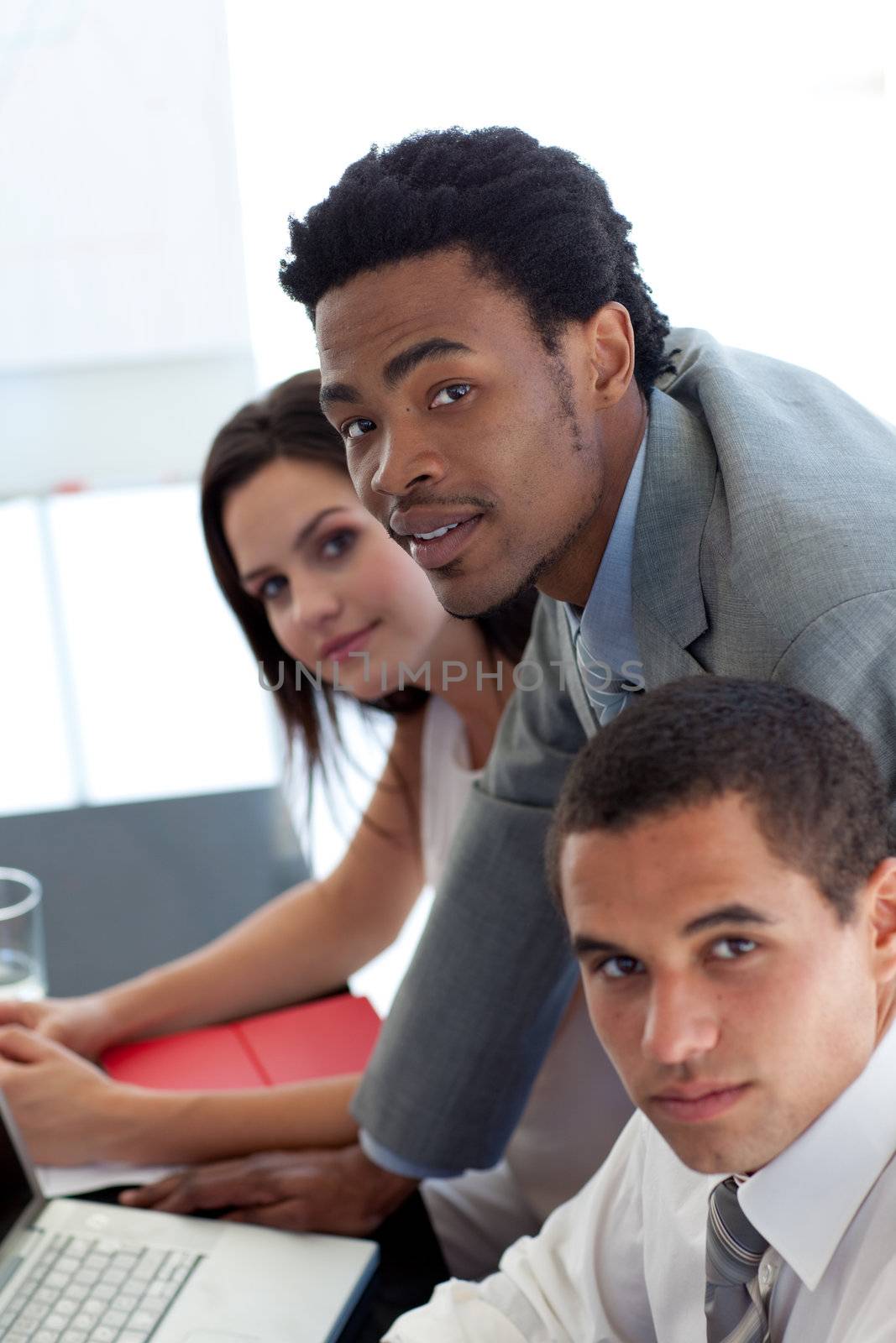 Afro-American businessman working with his team by Wavebreakmedia