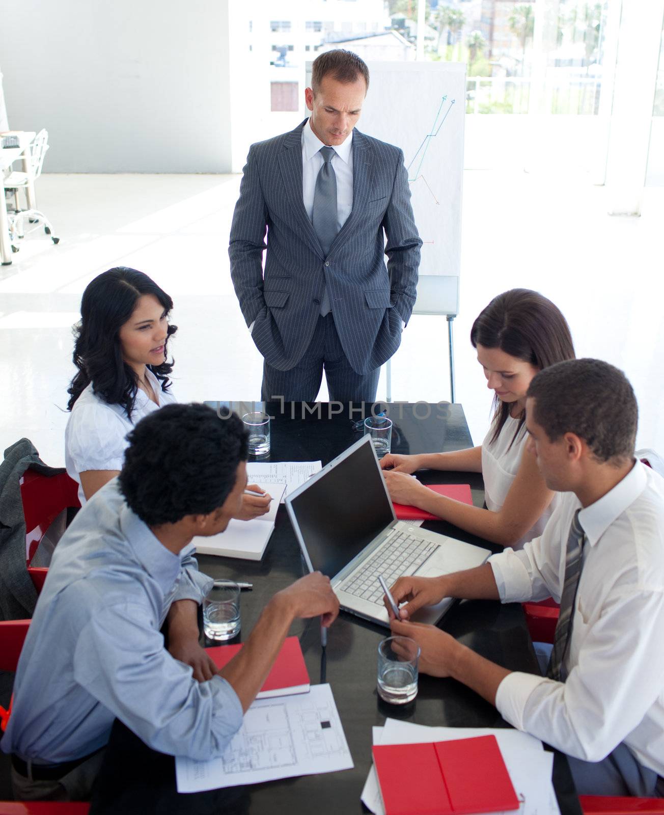 Multi-ethnic business people studying a new project in a meeting