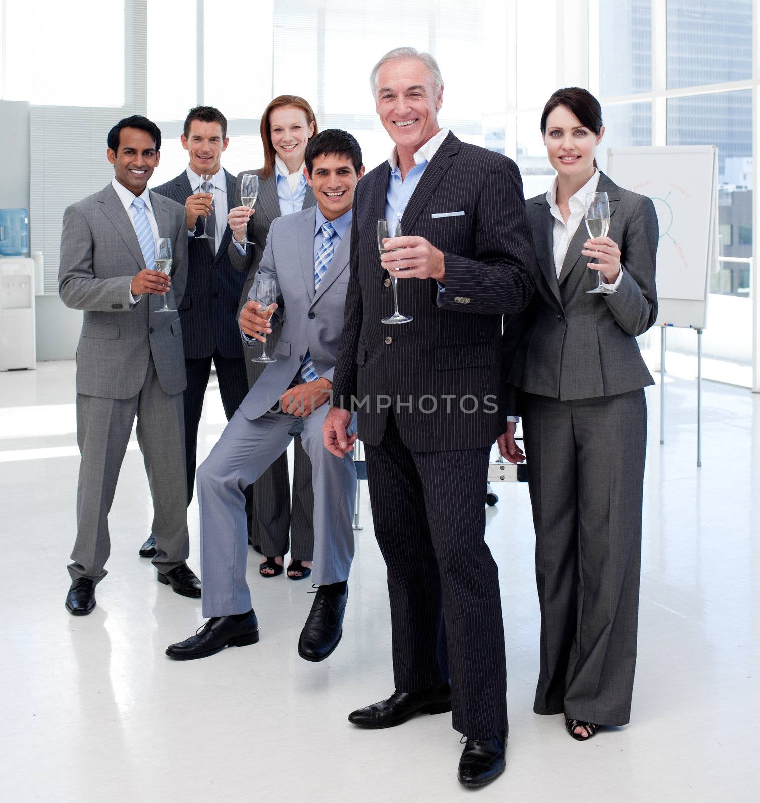 Multi-ethnic business people toasting with Champagne after a success 