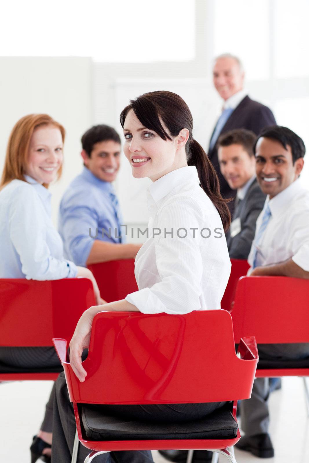 Attractive caucasian businesswoman at a conference by Wavebreakmedia