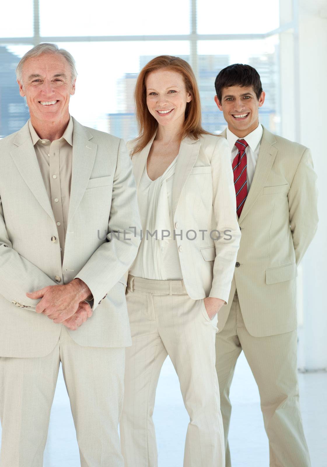 Confident business people standing together in a business building