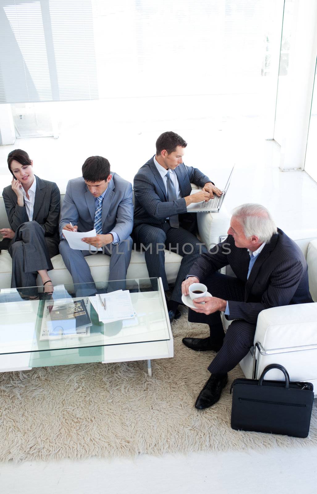 International Business people sitting and waiting for a job inte by Wavebreakmedia