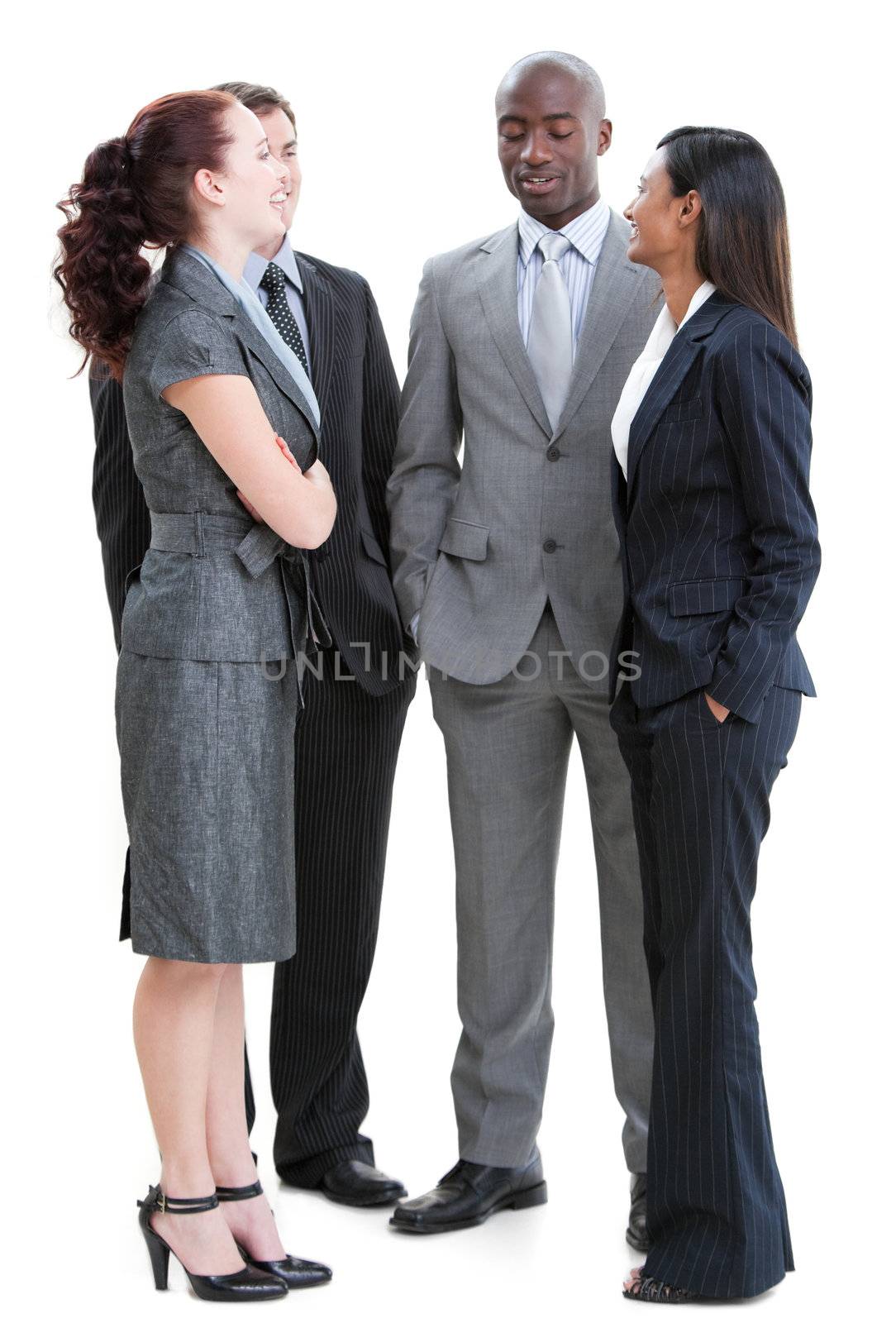 Cheerful business people interacting standing against a white background