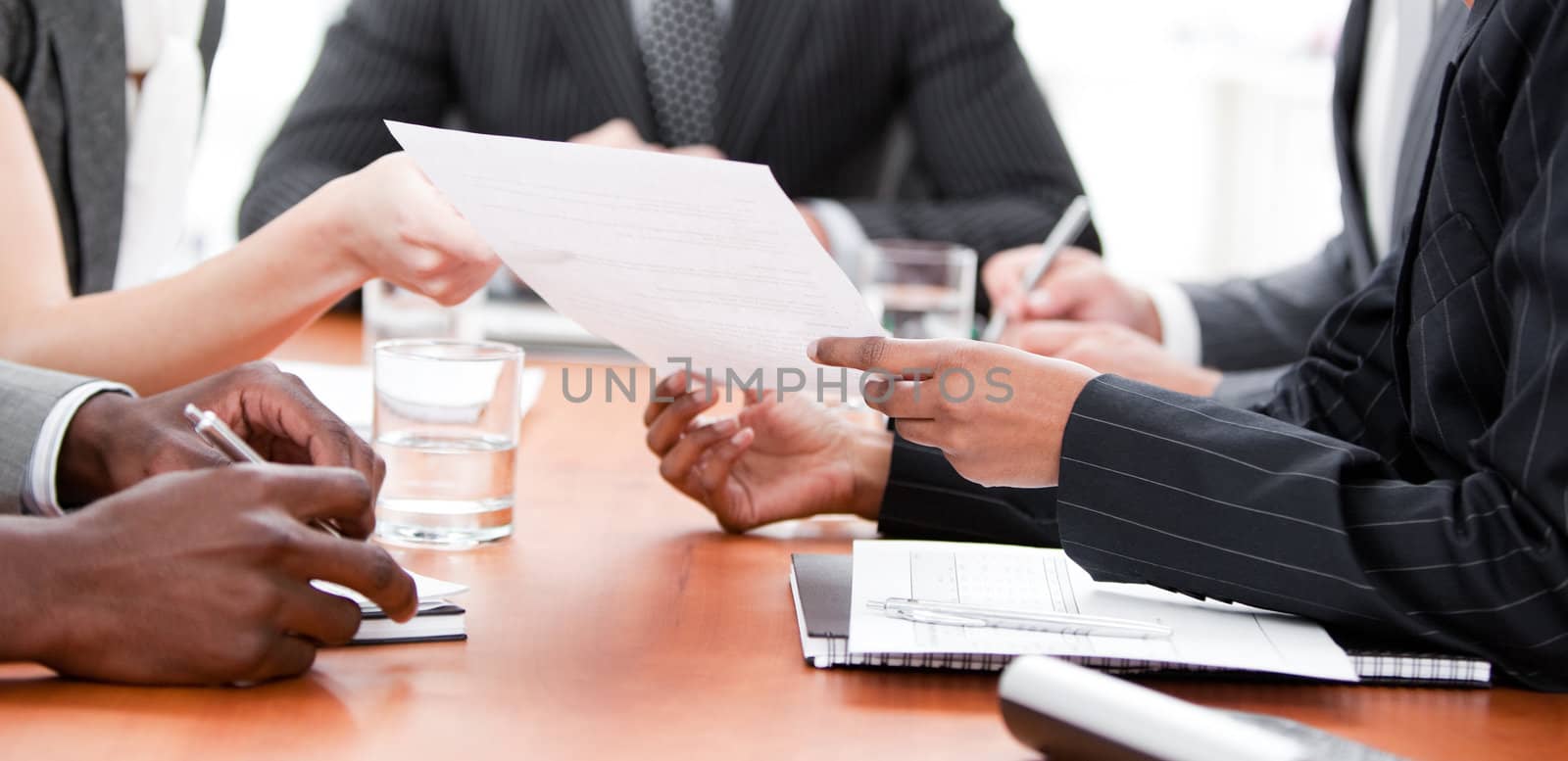 Close-up of multi-ethnic business people in a meeting by Wavebreakmedia