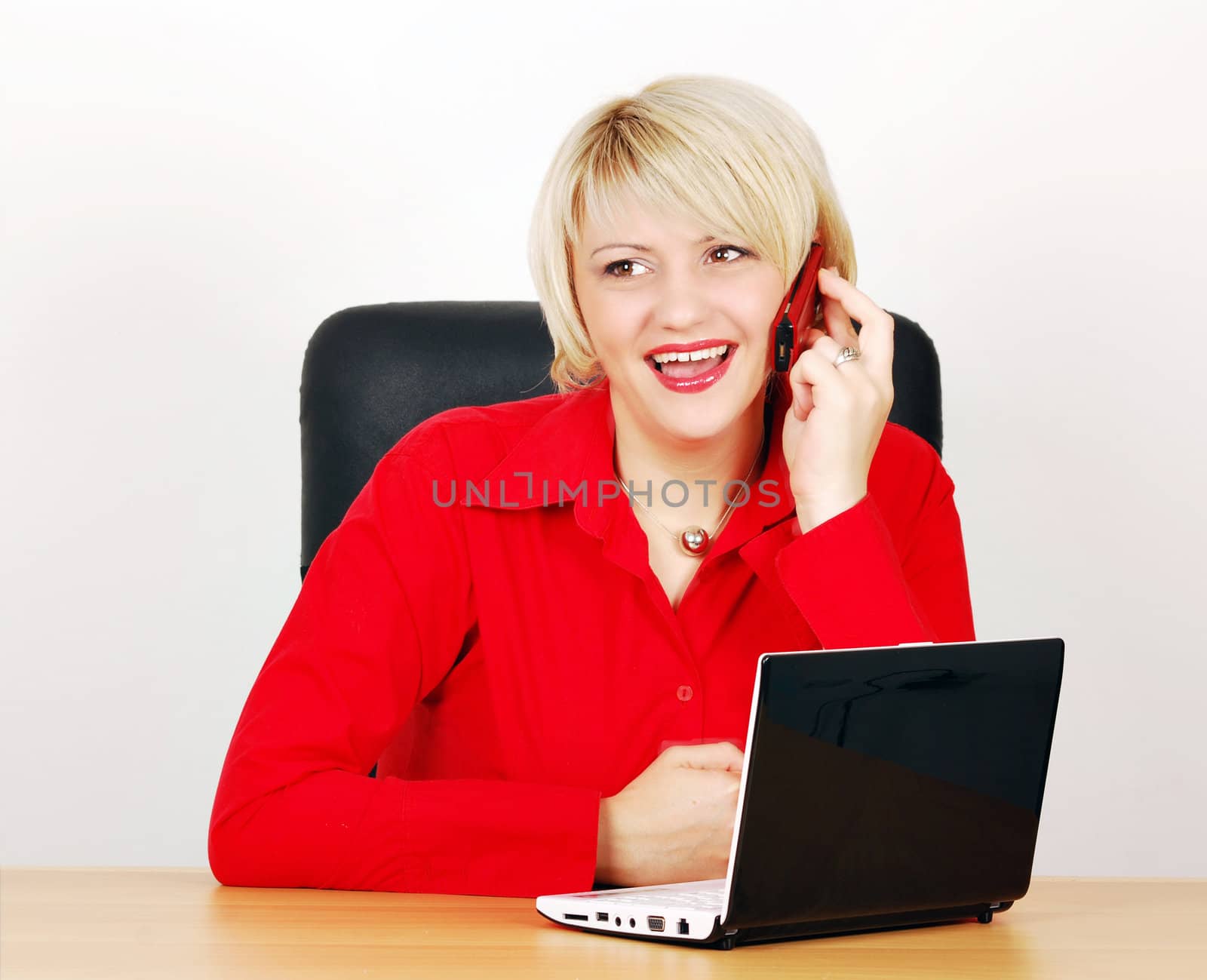 Business woman with phone and laptop