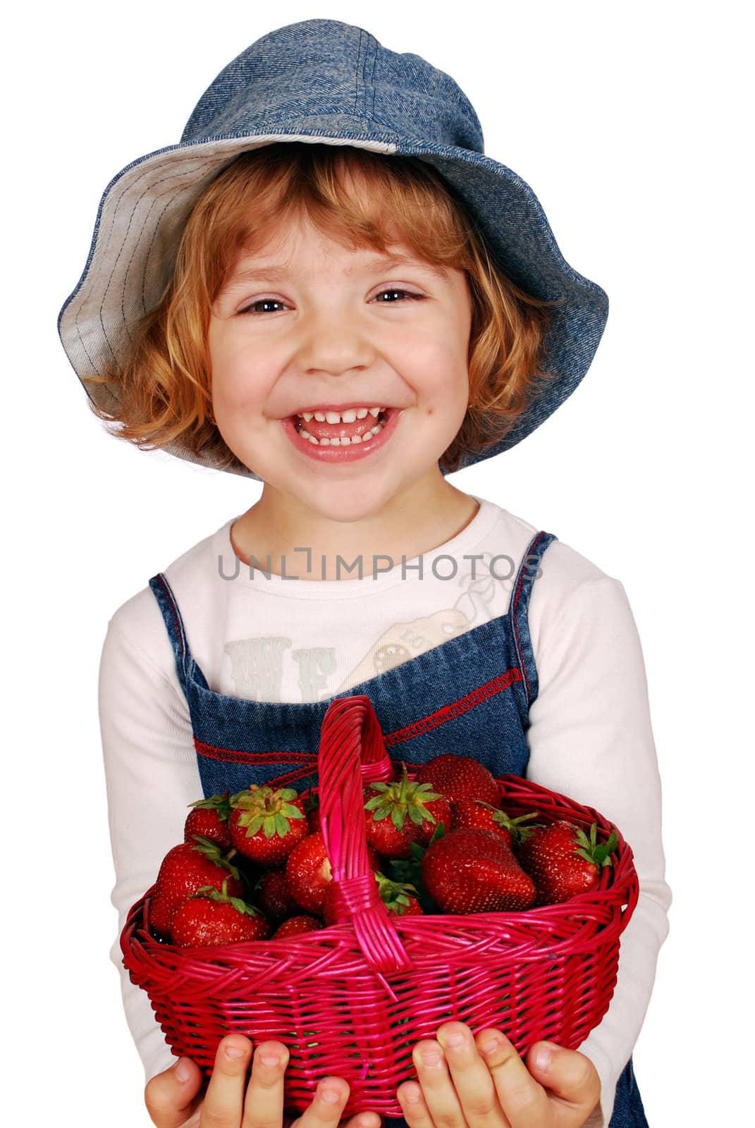 Happy little girl with strawberries