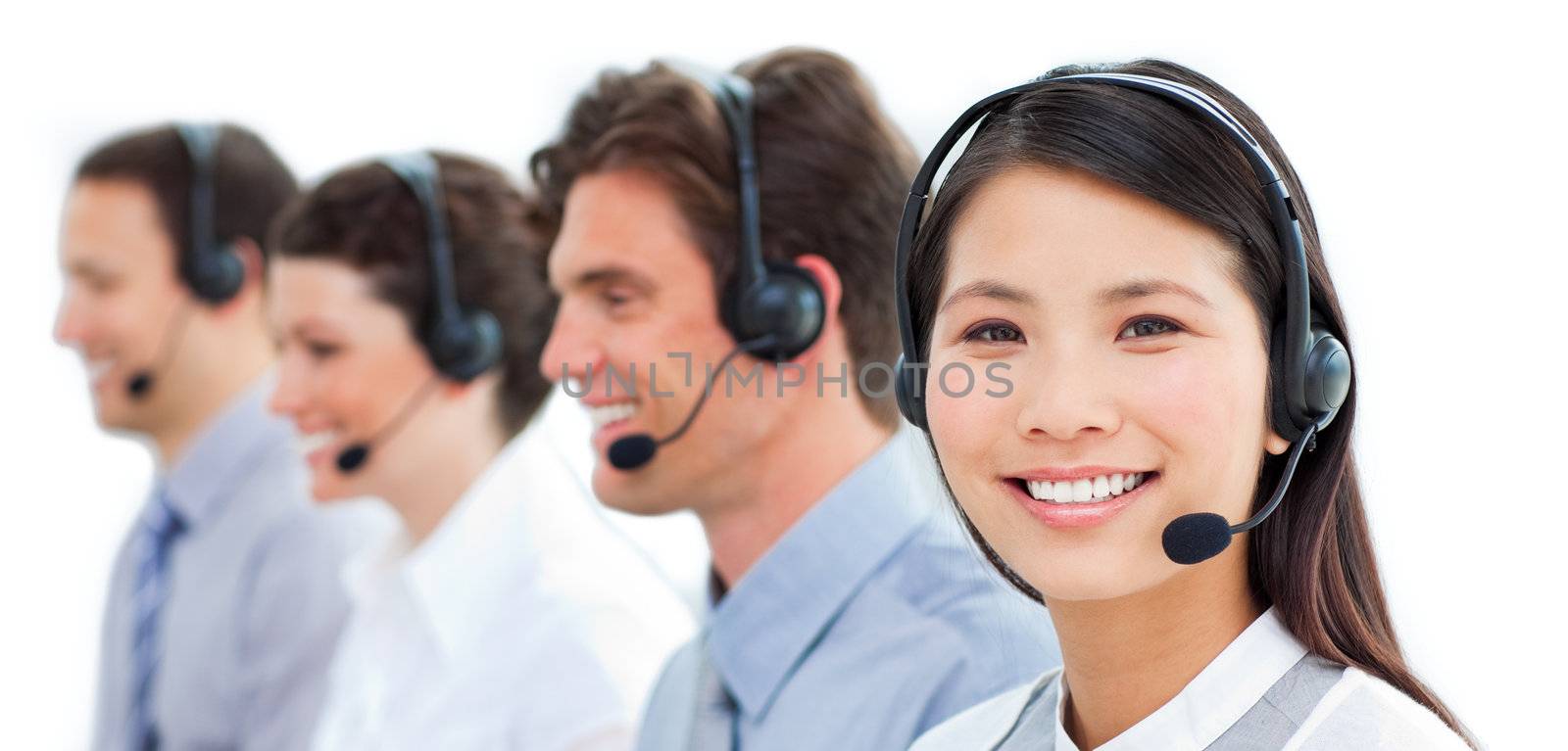 Assertive business people in a call center by Wavebreakmedia