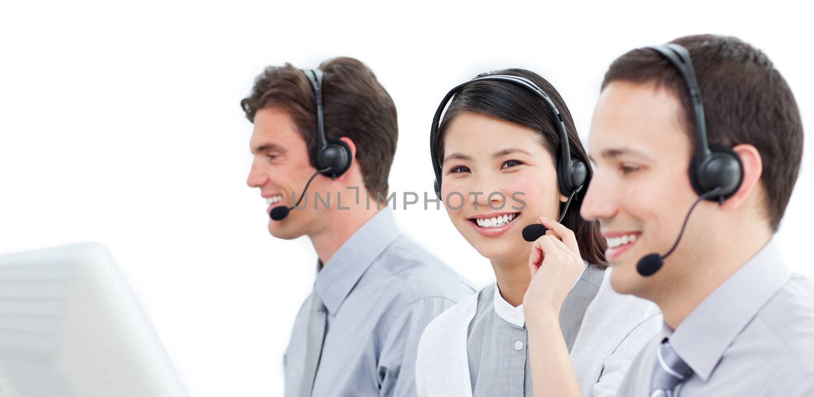 Assertive customer service agents working in a call center against a white background