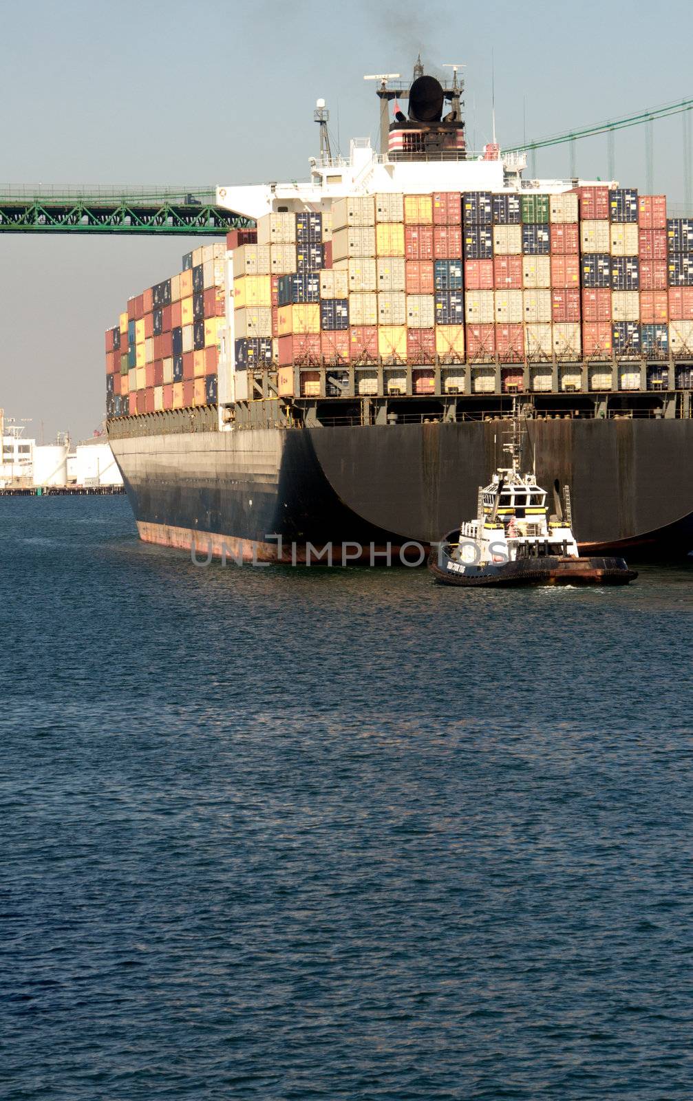 Huge container ship under the historic Vincent Thomas Bridge in San Pedro (Port of Los Angeles)