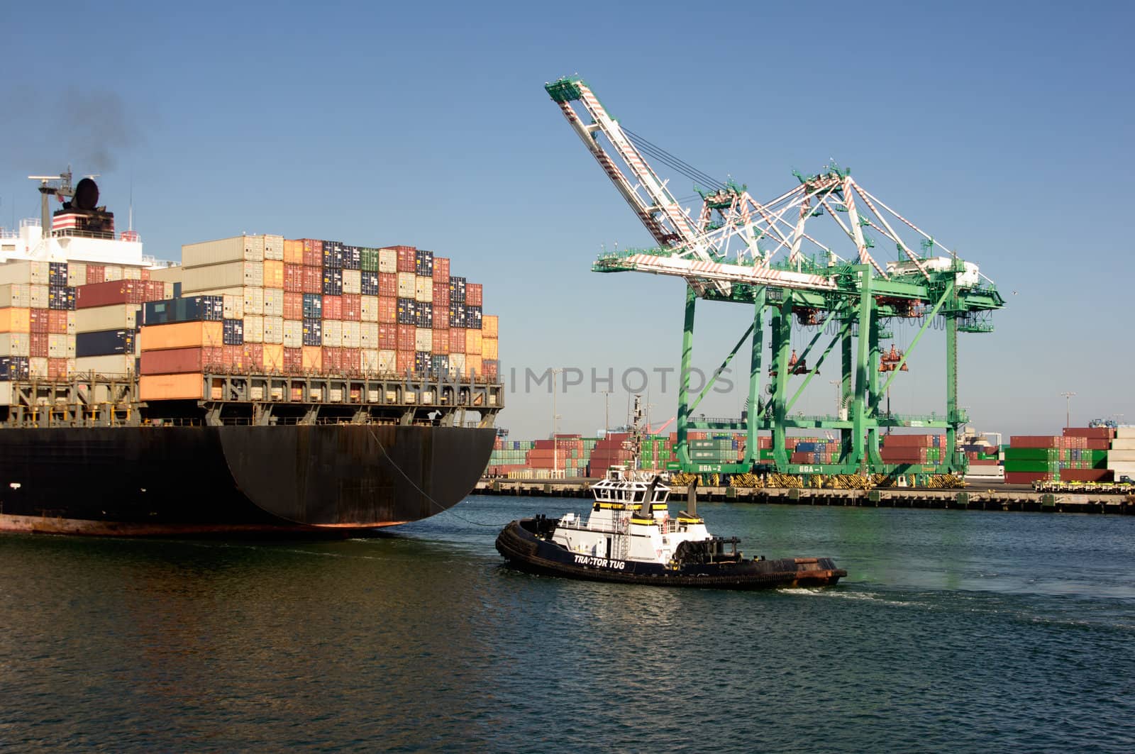 Huge container ship under the historic Vincent Thomas Bridge in San Pedro (Port of Los Angeles)