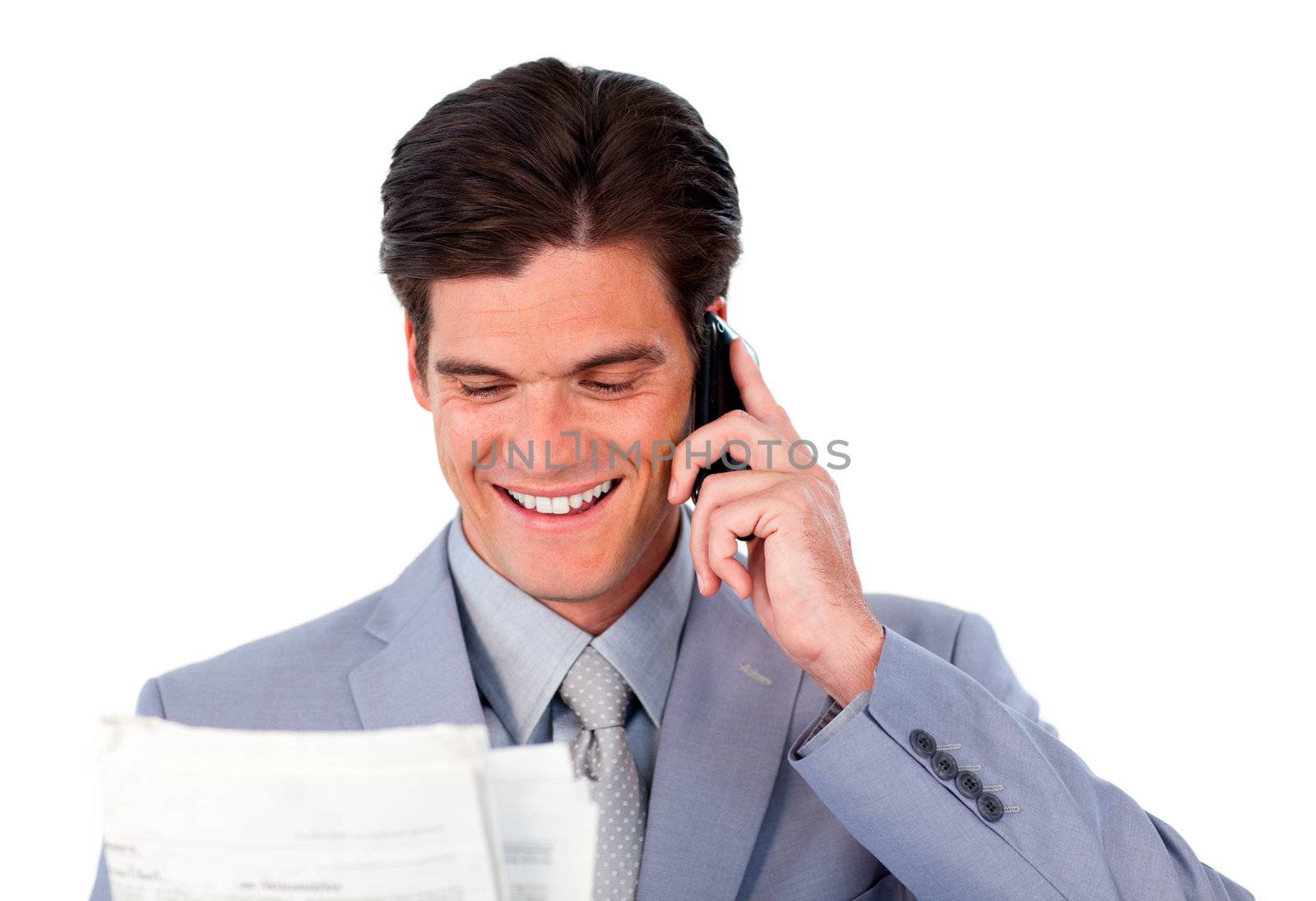 Happy businessman on phone holding a newspaper isolated on a white background